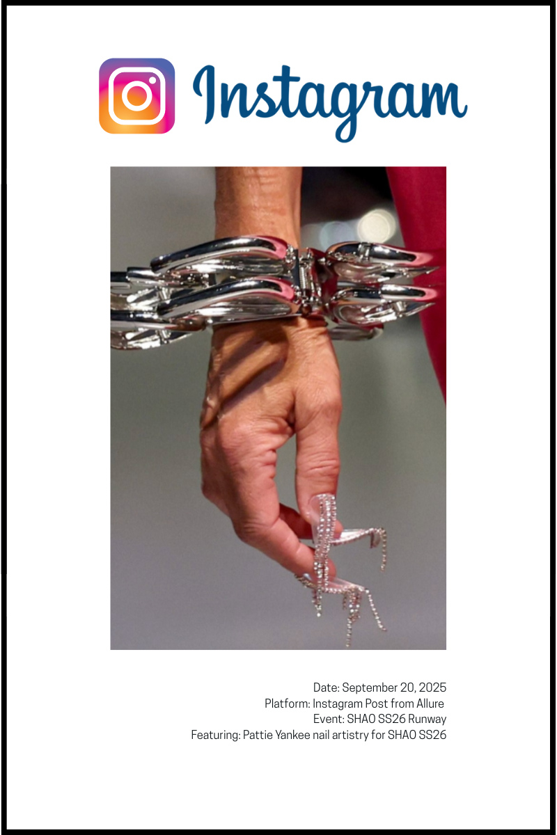 A close-up shot shows a hand with long, intricate rhinestone-studded nails and a large silver bracelet.