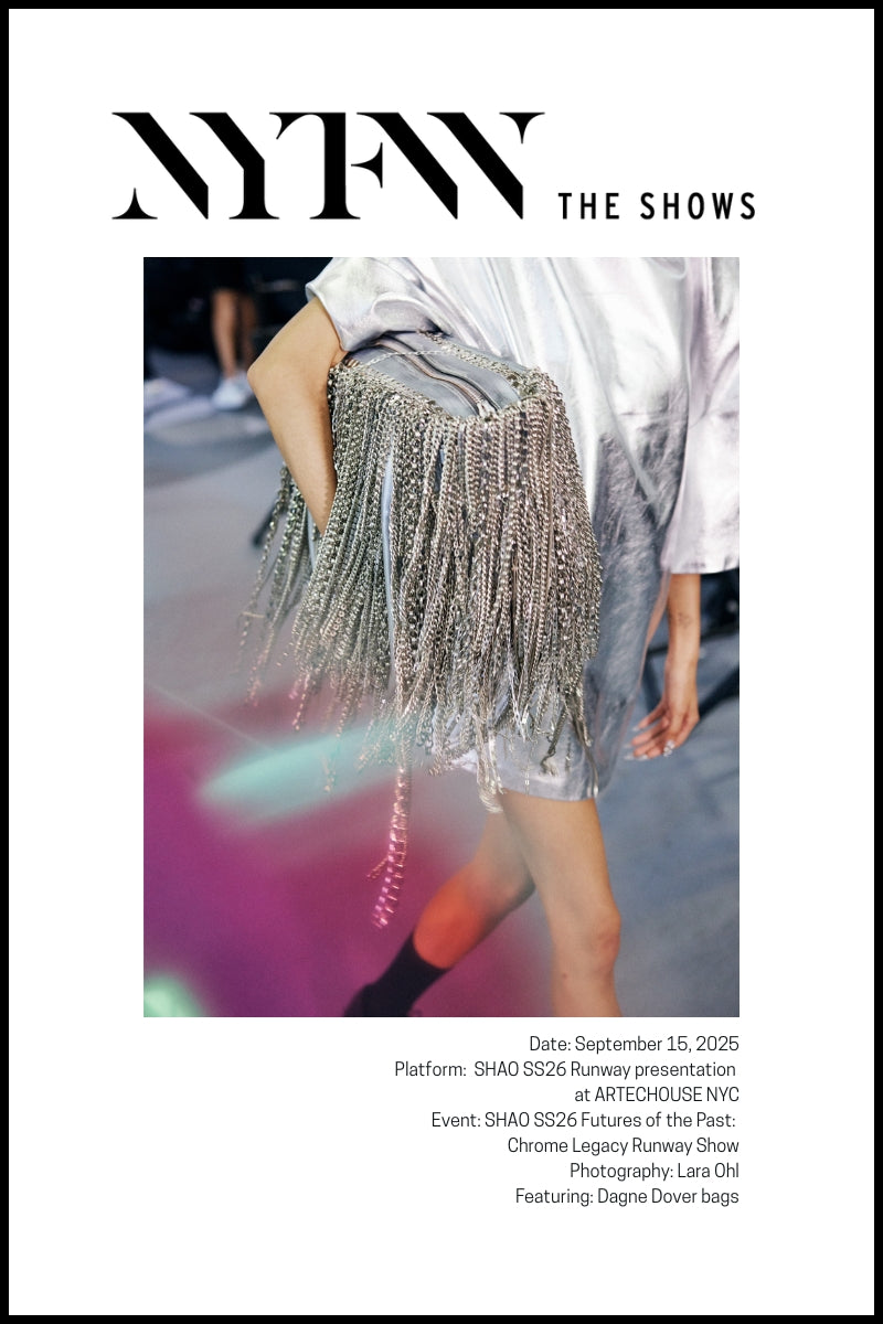A model on a runway carries a silver fringe Dagne Dover bag.