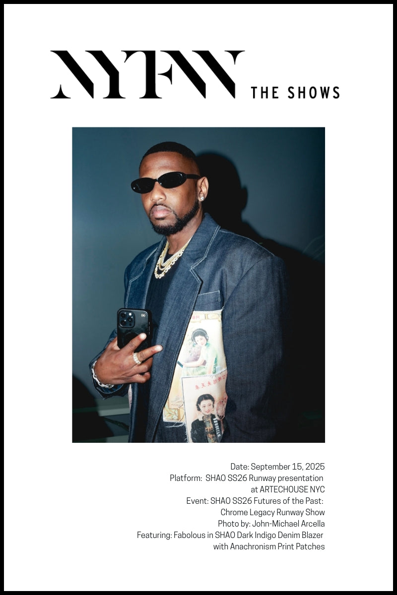 The rapper Fabolous, wearing a SHAO Dark Indigo Denim Blazer with Anachronism Print Patches, is seen at a runway show.