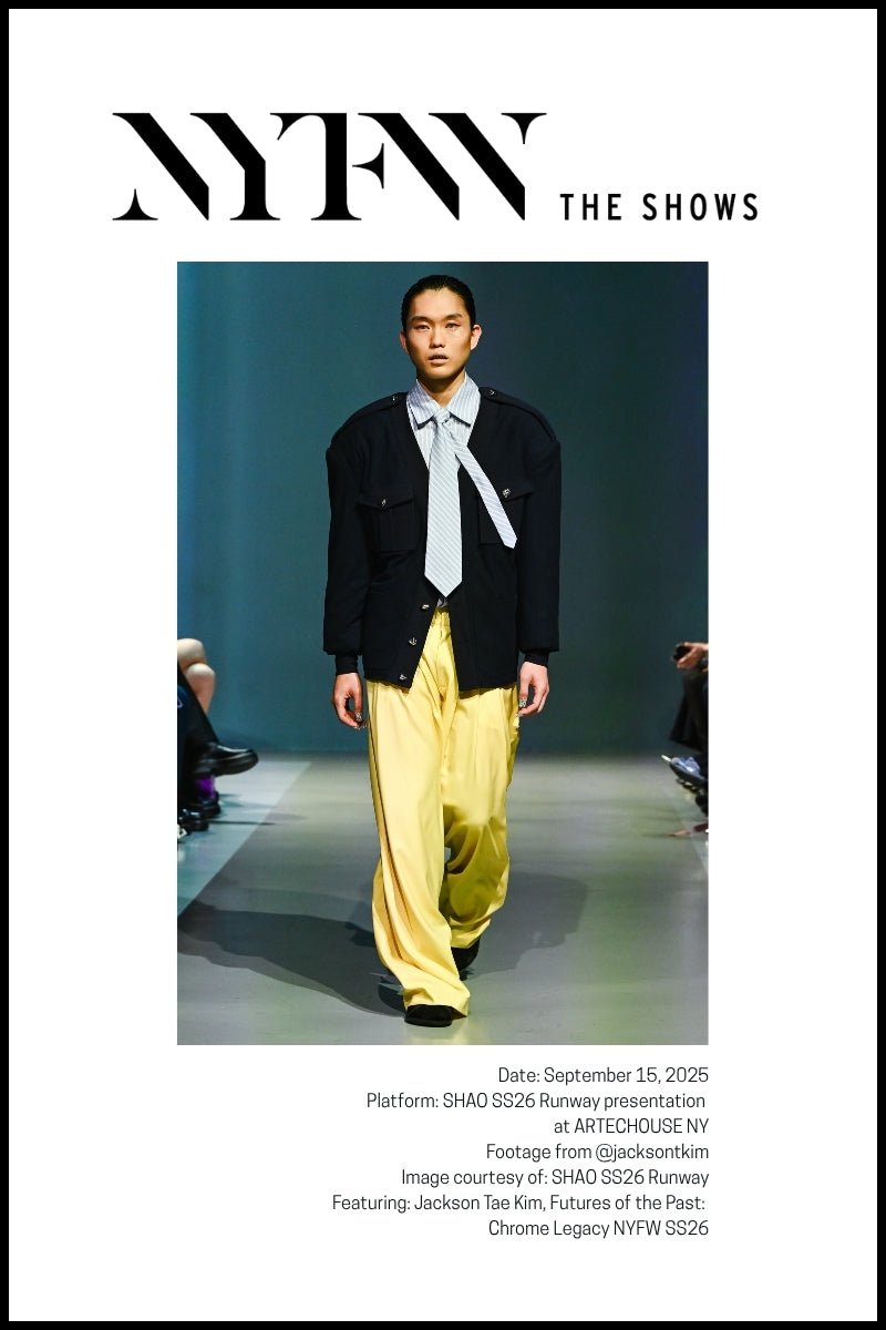 Model Jackson Tae Kim walks the runway in a black jacket, a light-colored tie, and billowy yellow pants.