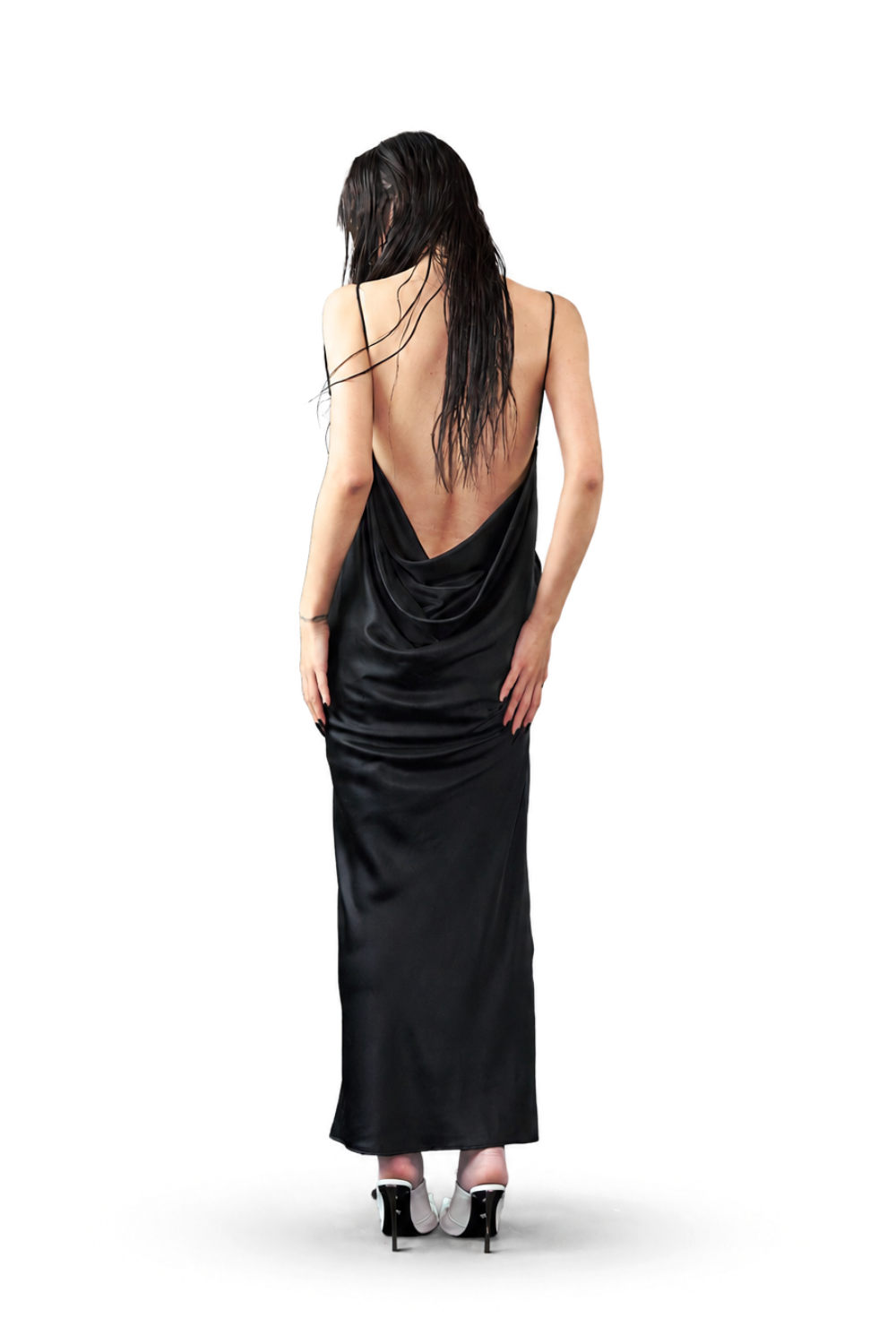 Model wears the Pierced Cowlback Slip Dress in glossy black satin with a dramatic low open back and delicate thin straps, highlighting SHAO New York bespoke tailoring and luxury designer fashion.