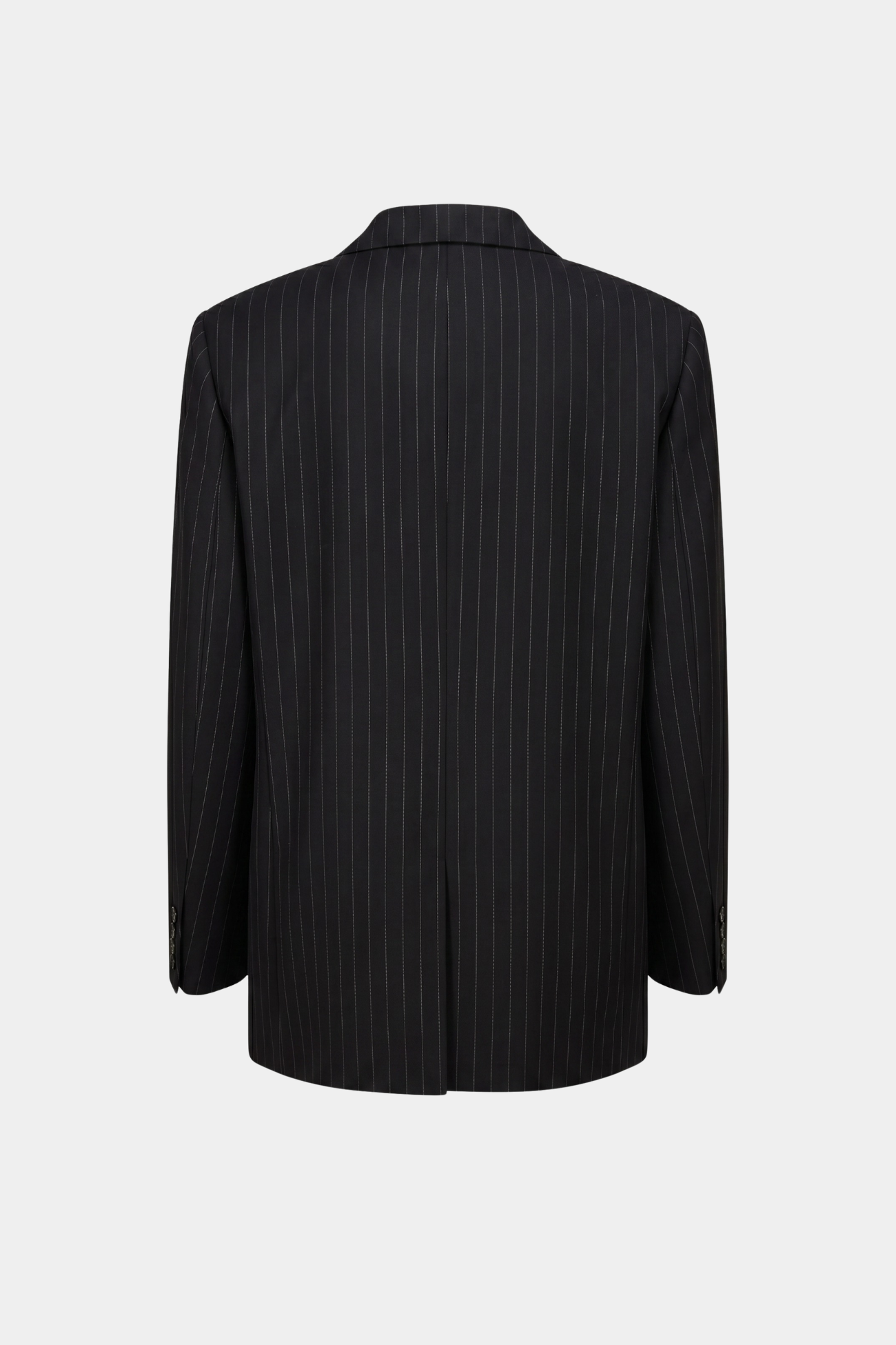 Black Pinstripe Boxy Oversized Jacket shown from the back, featuring fine vertical pinstripes, a relaxed sculptural silhouette, and tailored details, reflecting SHAO New York bespoke tailoring.