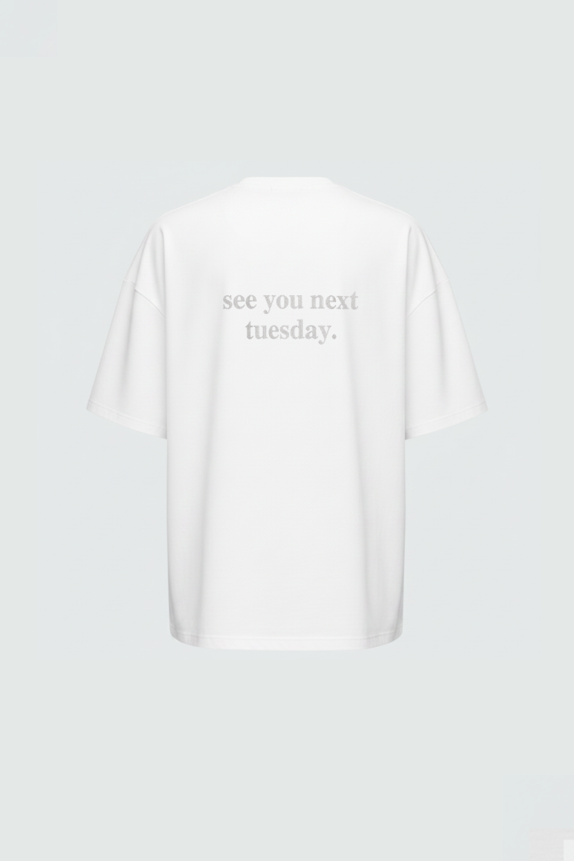 White "See You Next Tuesday" Oversized Graphic Tee with Chinese Text shown from the back, featuring a relaxed silhouette and subtle tonal lettering for a modern luxury designer fashion look.