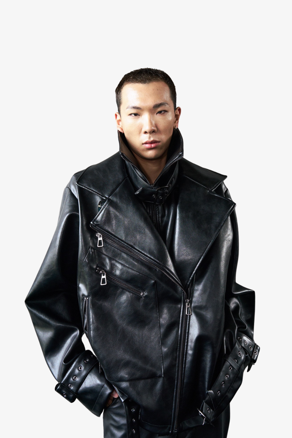 Close-up front view of a model wearing the Vegan Leather Oversized Biker Coat in black with exaggerated sculptural lapels, asymmetrical zippers, and adjustable buckle straps, showcasing SHAO New York luxury designer fashion and expert New York designer tailoring.