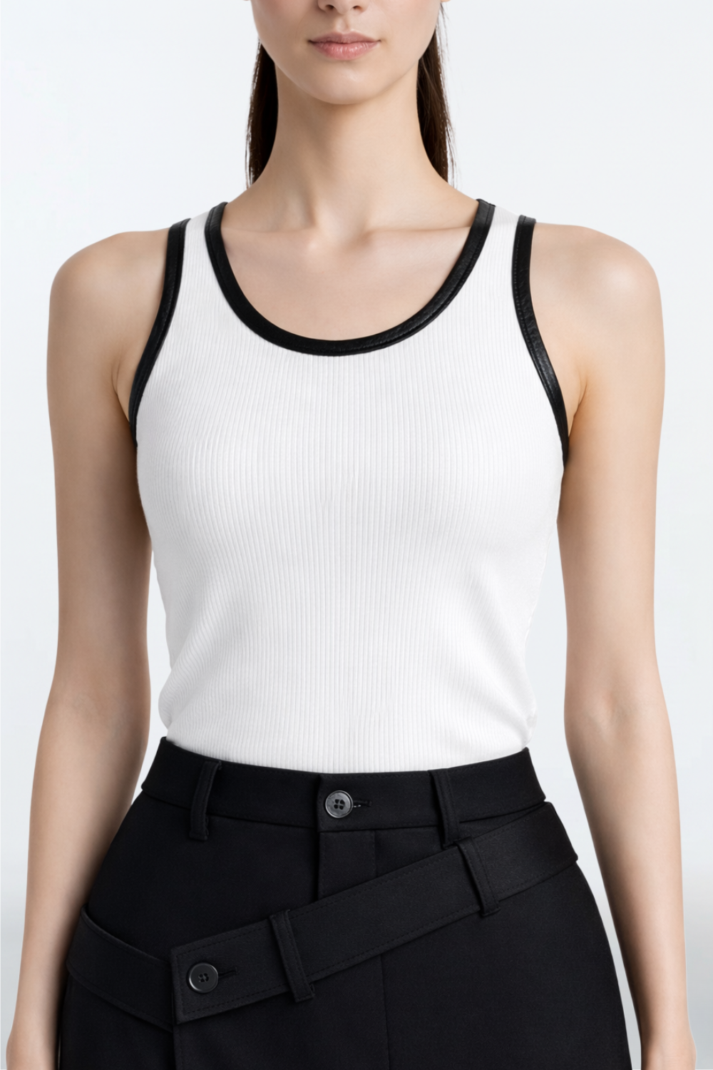 White Rib-Knit Tank Top with Leather Trim featuring a sleek ribbed texture and contrasting black leather edging, embodying SHAO New York’s luxury designer fashion with a sculptural, tailored look.