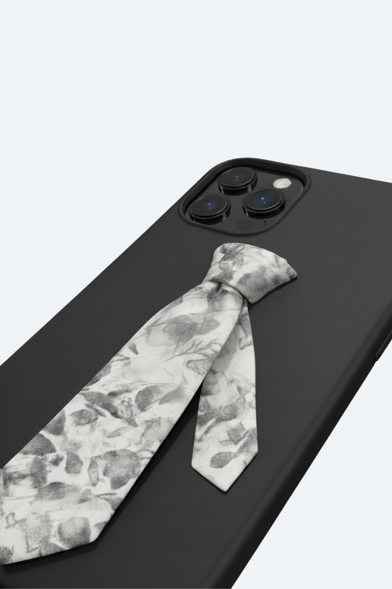 Floral Tie Phone Case Limited Edition featuring a sculptural monochrome floral tie detail on a smooth black matte surface, inspired by SHAO New York bespoke tailoring and luxury designer fashion.