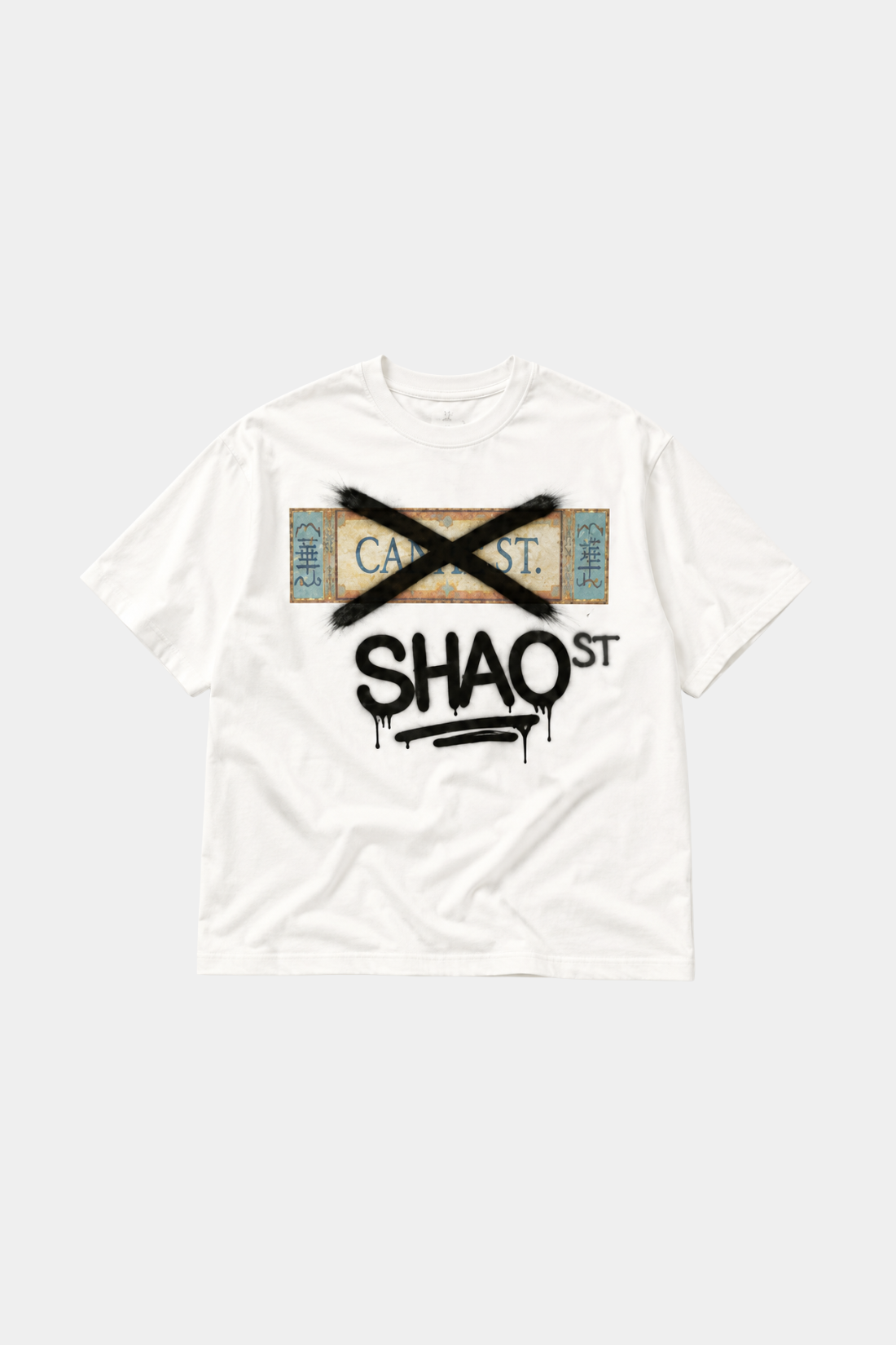 NYC Icons | "SHAO Street" Boxy T-shirt in white featuring a bold graphic of a street sign crossed out with black paint and dripping spray-paint style lettering, reflecting urban luxury designer fashion.