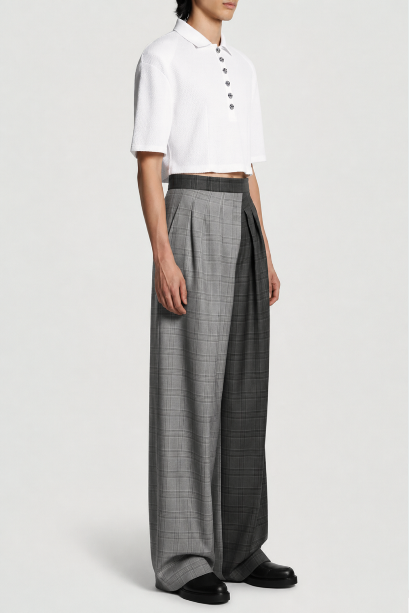 Model wearing White Textured Cropped Polo Top with short sleeves and a buttoned front placket, styled with wide-leg checked trousers for a modern, tailored luxury designer fashion look.