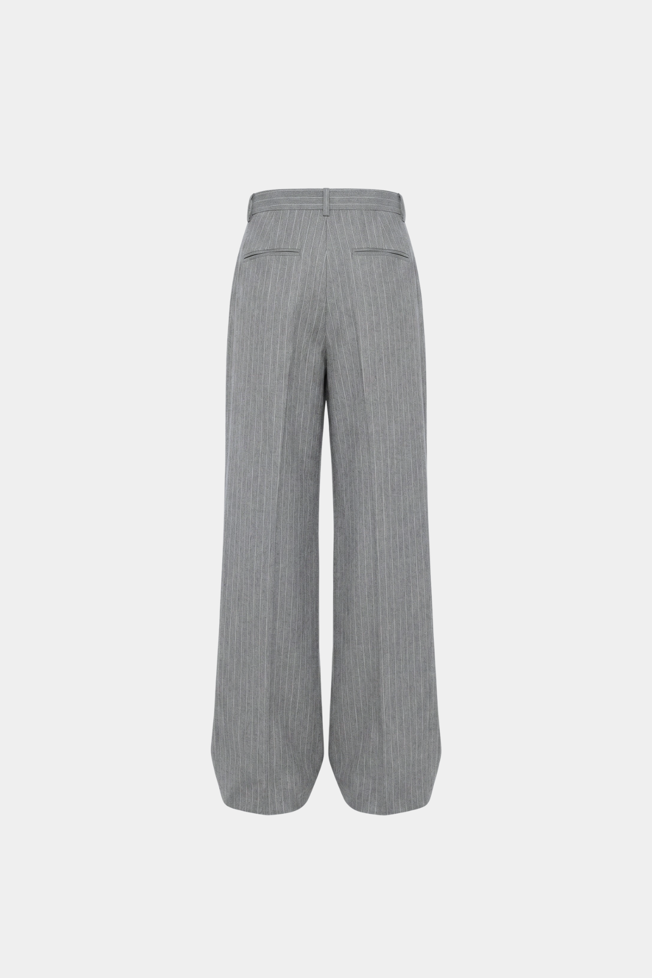 Back view of Grey Pinstripe Stacked Trousers showcasing a high waist, vertical pinstripes, rear welt pockets, and a wide leg silhouette with a subtle sculptural drape, reflecting bespoke tailoring.