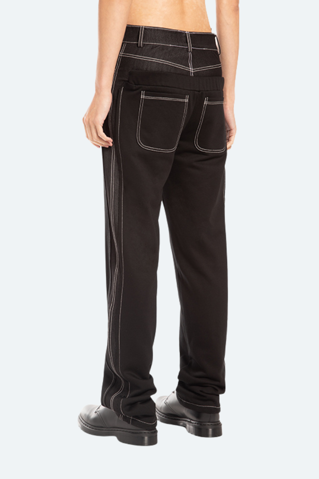 Back view of black hybrid trousers with technical seam detailing