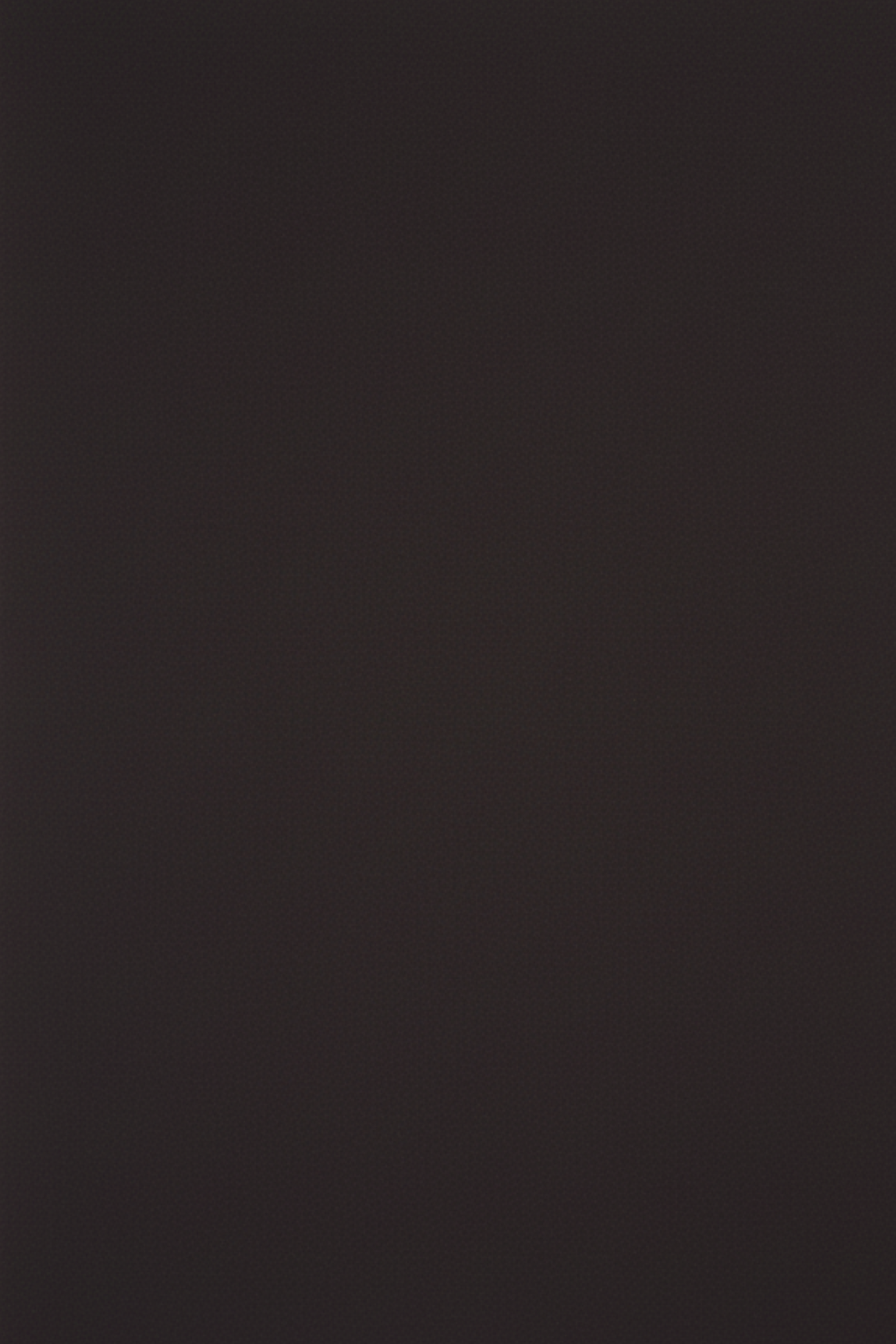 Close-up swatch of black denim and suiting fabric from hybrid trousers