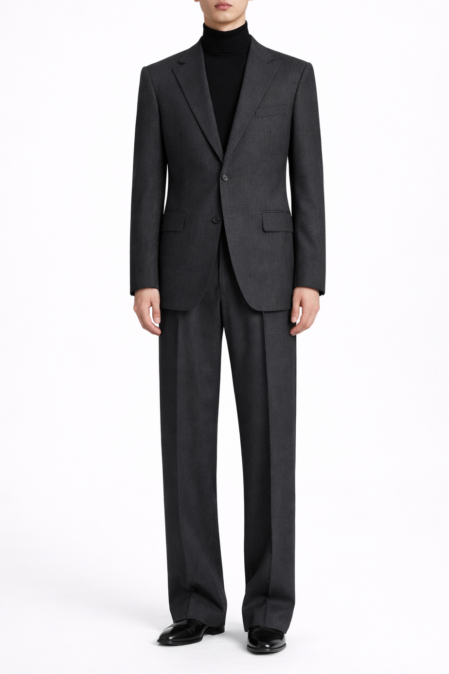 Model wearing a Charcoal Grey Relaxed Fit Two Piece Suit with a two-button jacket, notch lapels, and wide-leg trousers, paired with a black turtleneck, showcasing SHAO New York bespoke tailoring and a refined sculptural silhouette.