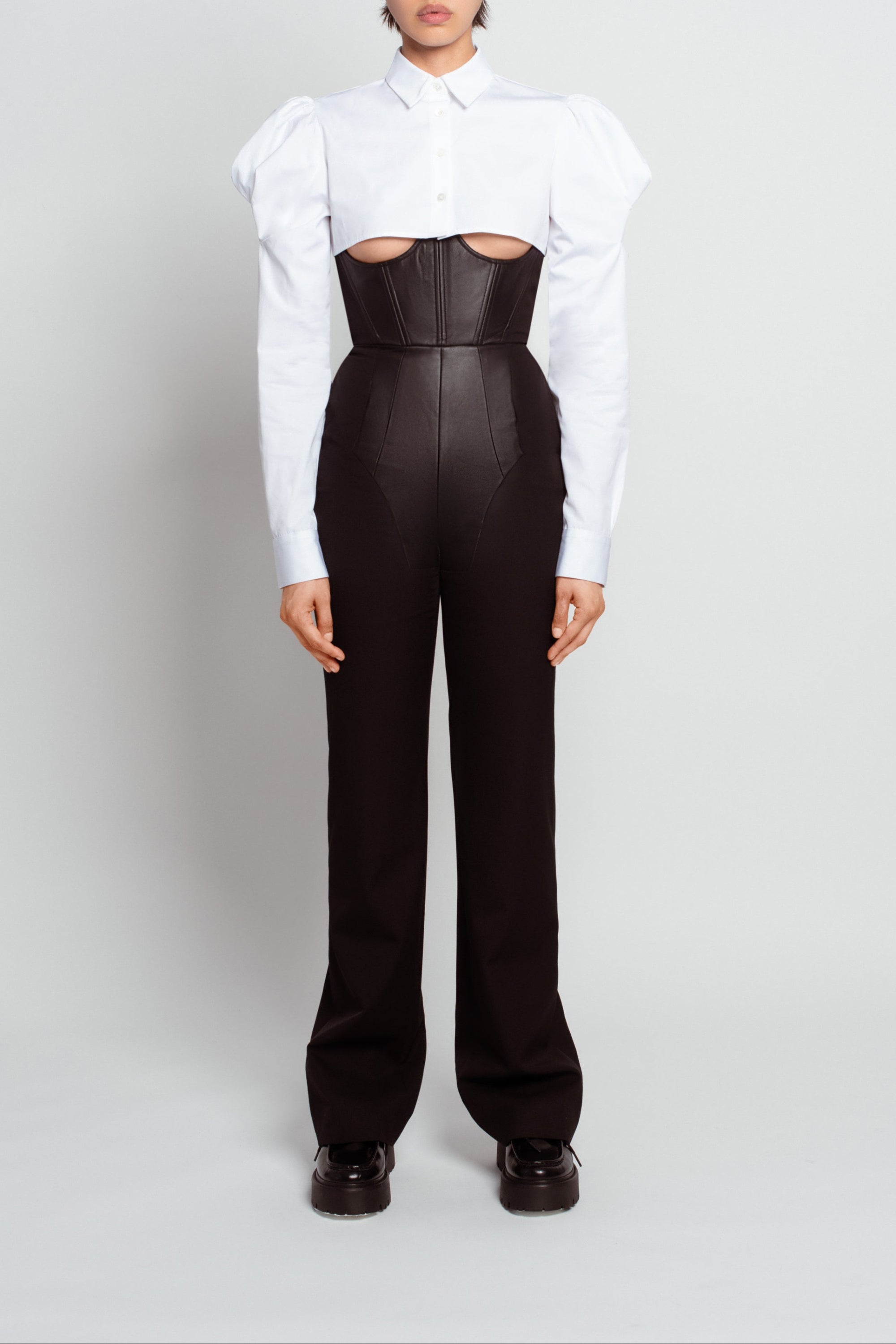 Front view of Jet Black Corset Trousers – High-Waisted Architectural Silhouette featuring tailored seam detailing, sculptural fit, and sleek luxury designer fashion with bespoke New York tailoring.