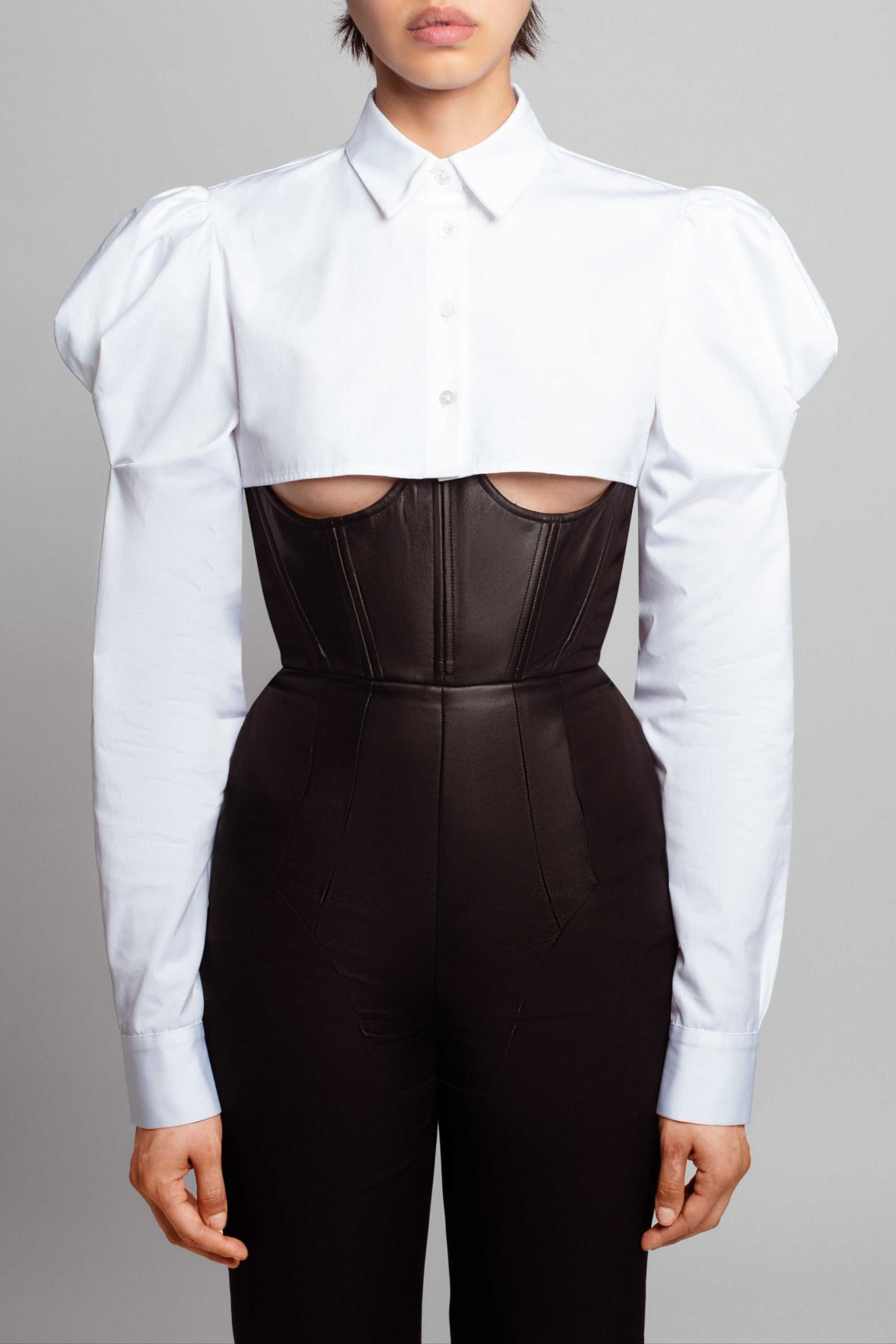 Front view of Essential White Button-Up Shirt – Dramatic Puffed Shoulders featuring a cropped tailored silhouette with structured sleeves, showcasing sculptural luxury designer fashion and New York bespoke tailoring.