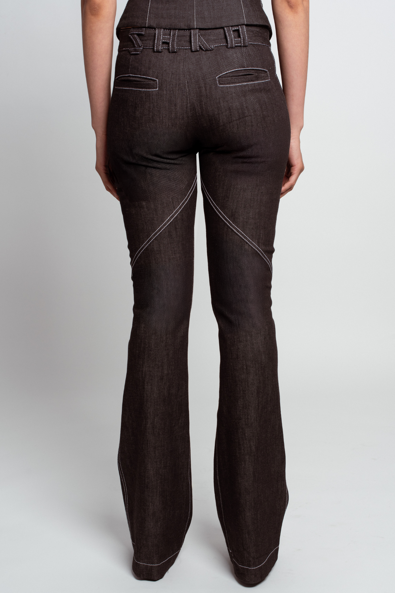 Dark Grey Lace-Up Flare Denim Trousers with sculptural contrast stitching, tailored flare legs, and structured back pocket detailing embodying SHAO New York bespoke tailoring and luxury designer fashion.