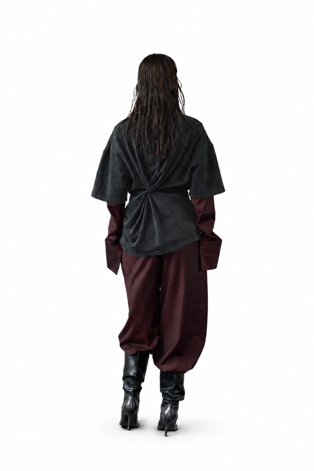 Model seen from the back wearing Wool Barrel Pleated Trousers - Burgundy with a dark oversized top featuring a twisted knot detail, paired with black heeled boots, highlighting a modern sculptural silhouette with SHAO New York bespoke tailoring influences.