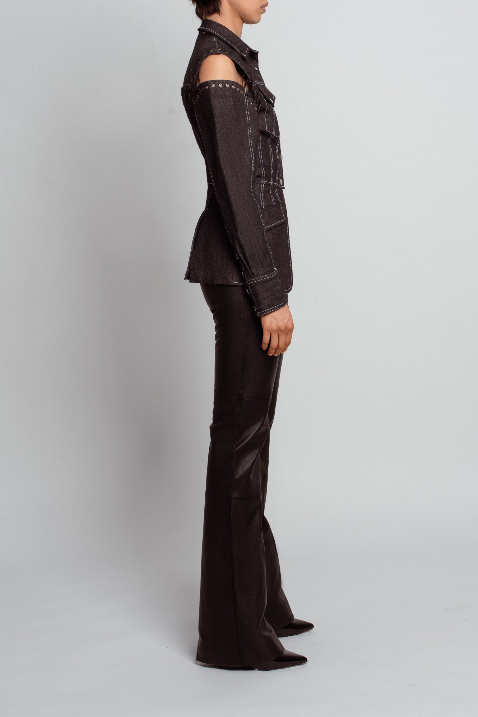 Black leather flare trousers side silhouette