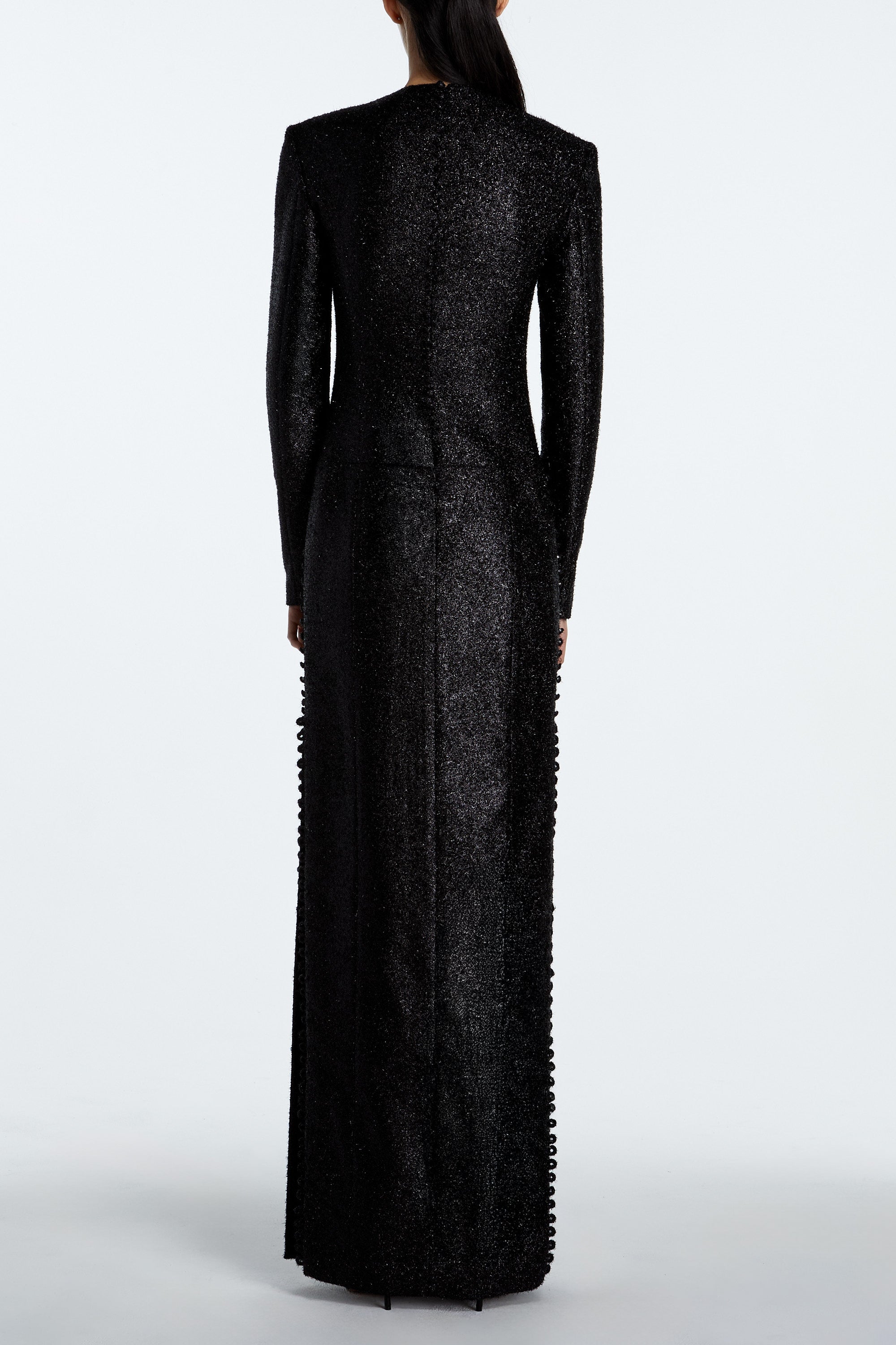 Black tinsel and wool evening gown back view