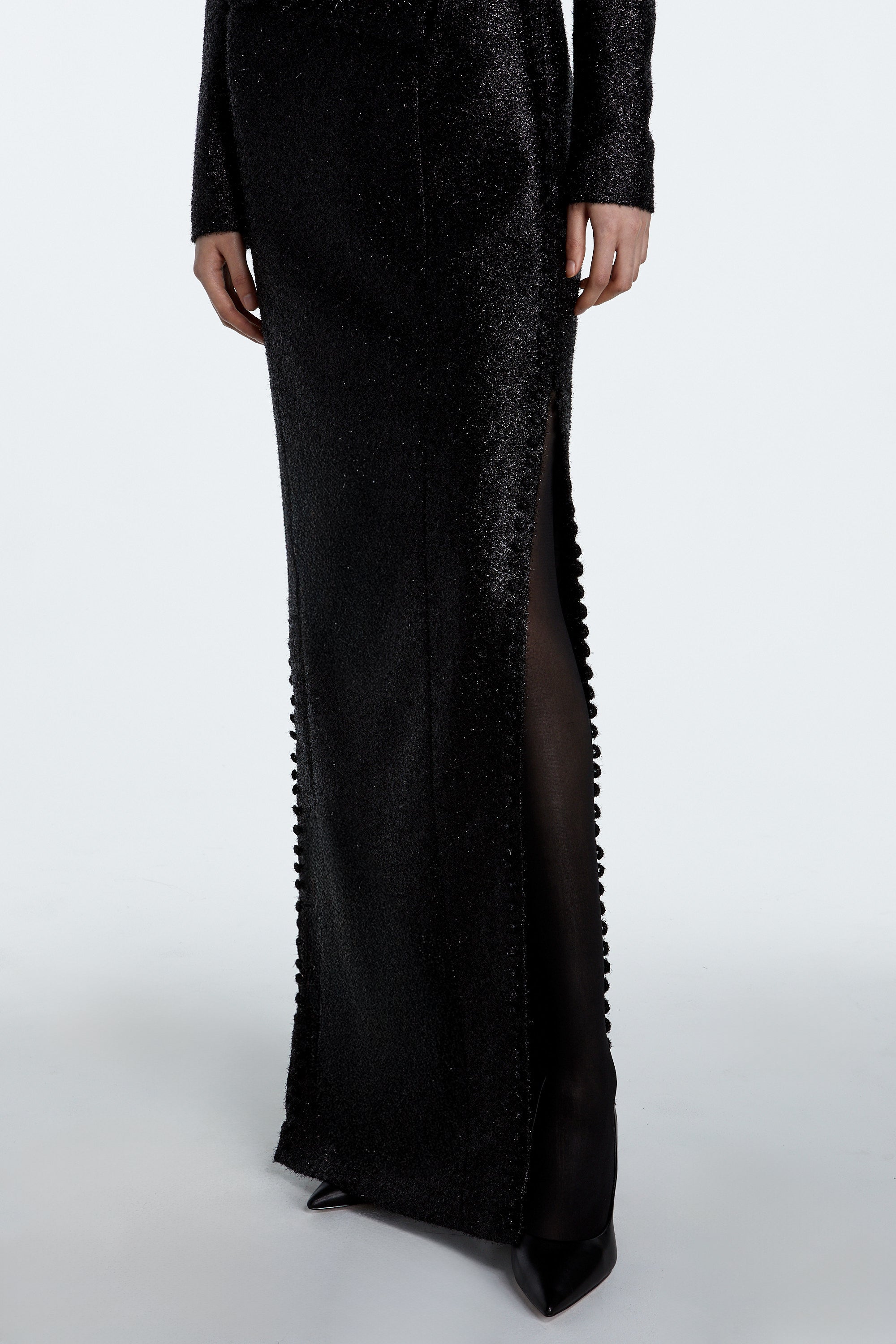 Black tinsel and wool fabric detail with subtle sheen