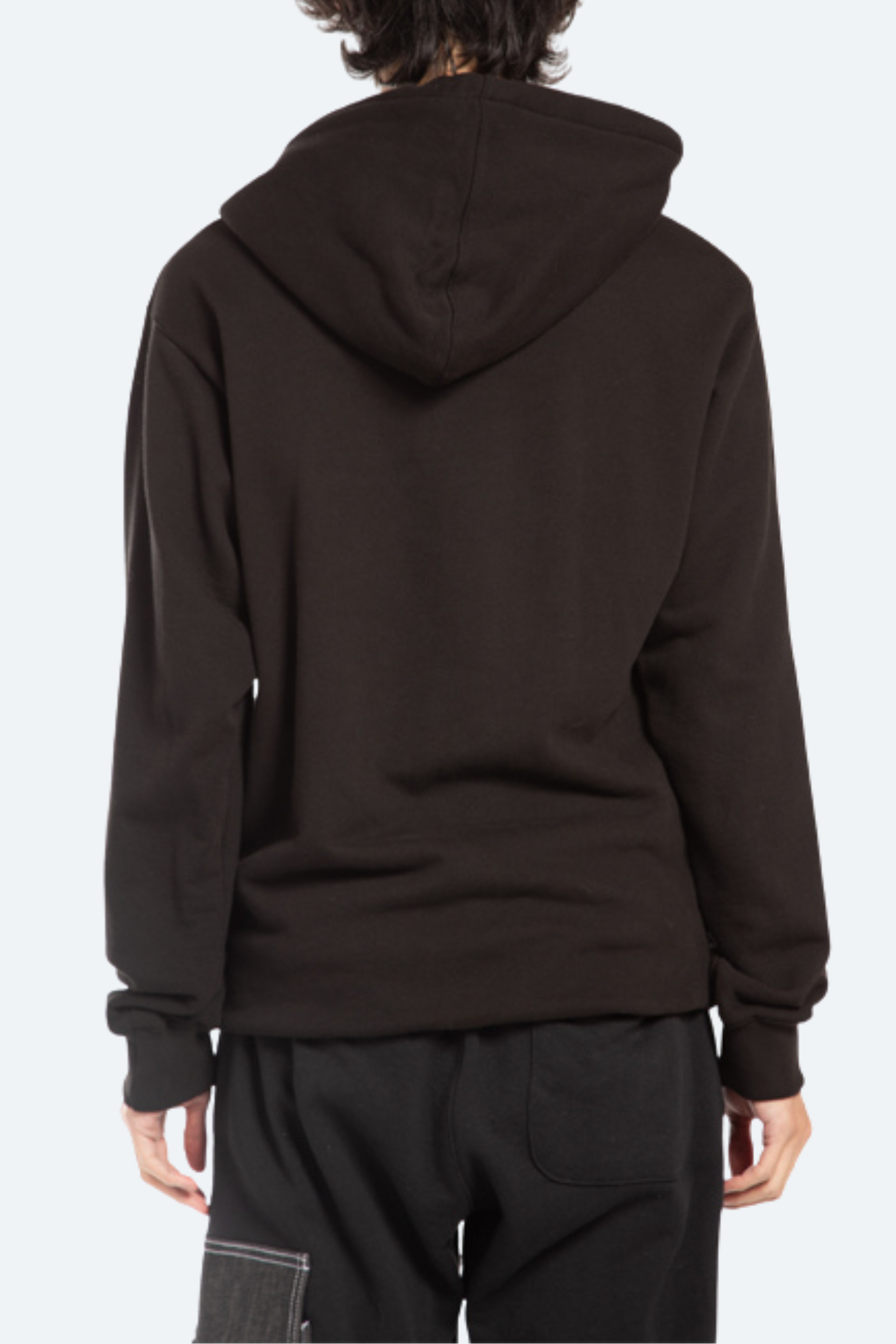 Back view of black oversized hoodie with long-line relaxed silhouette