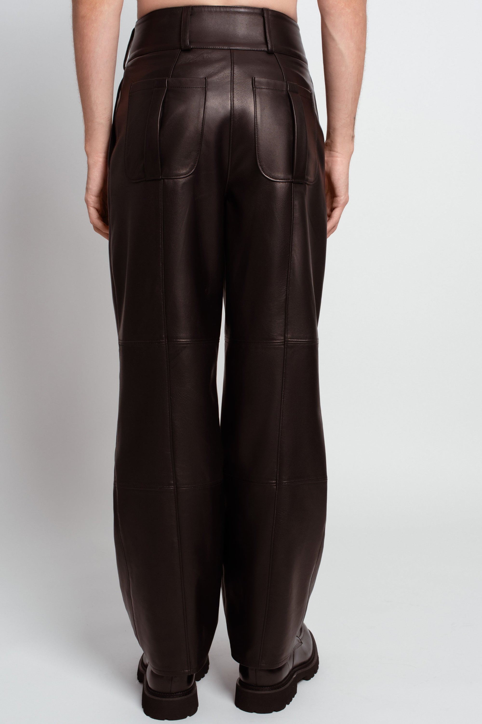 Jet black leather pleated trousers structured back view