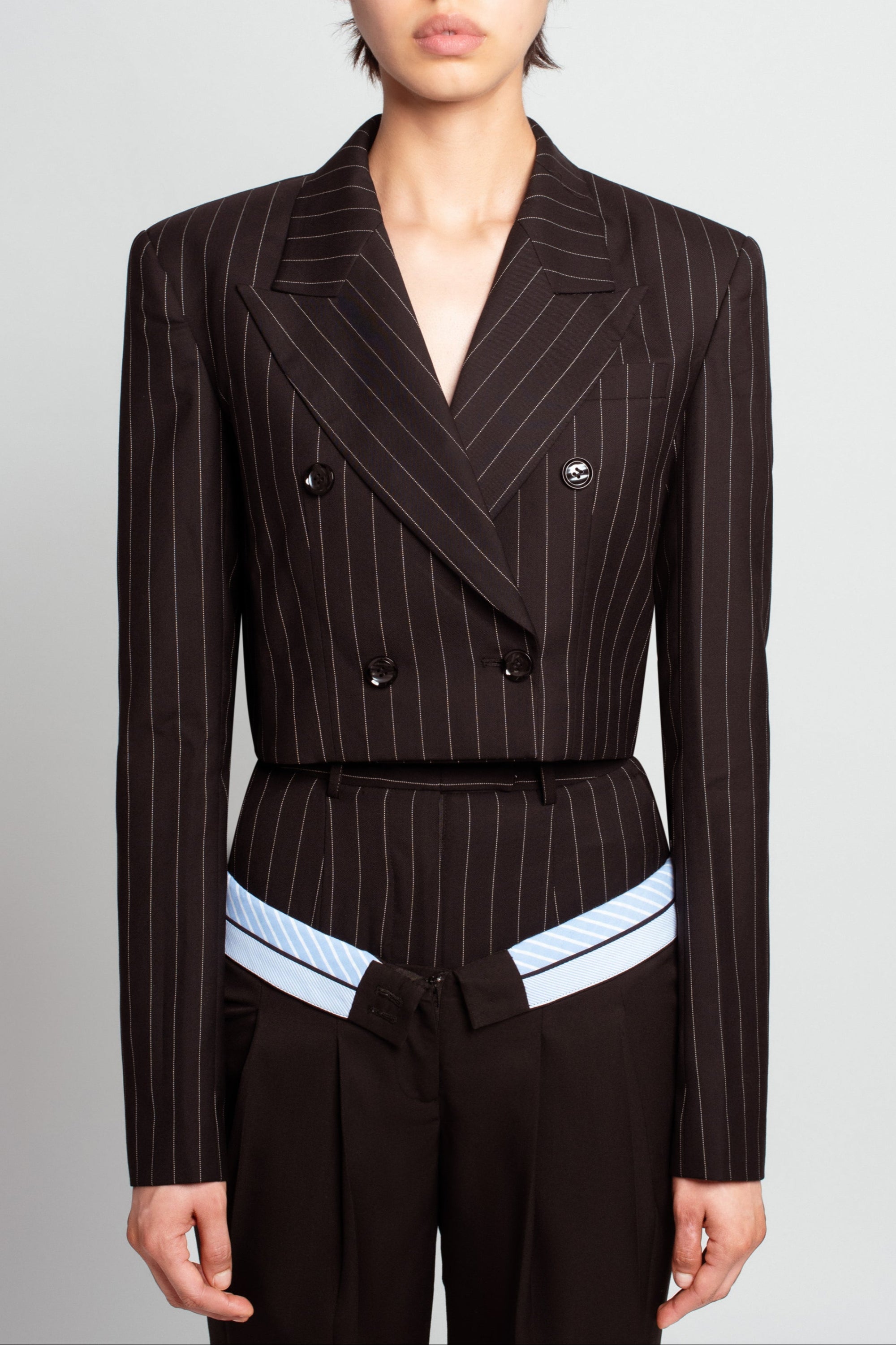 Black pinstripe double-breasted blazer detail