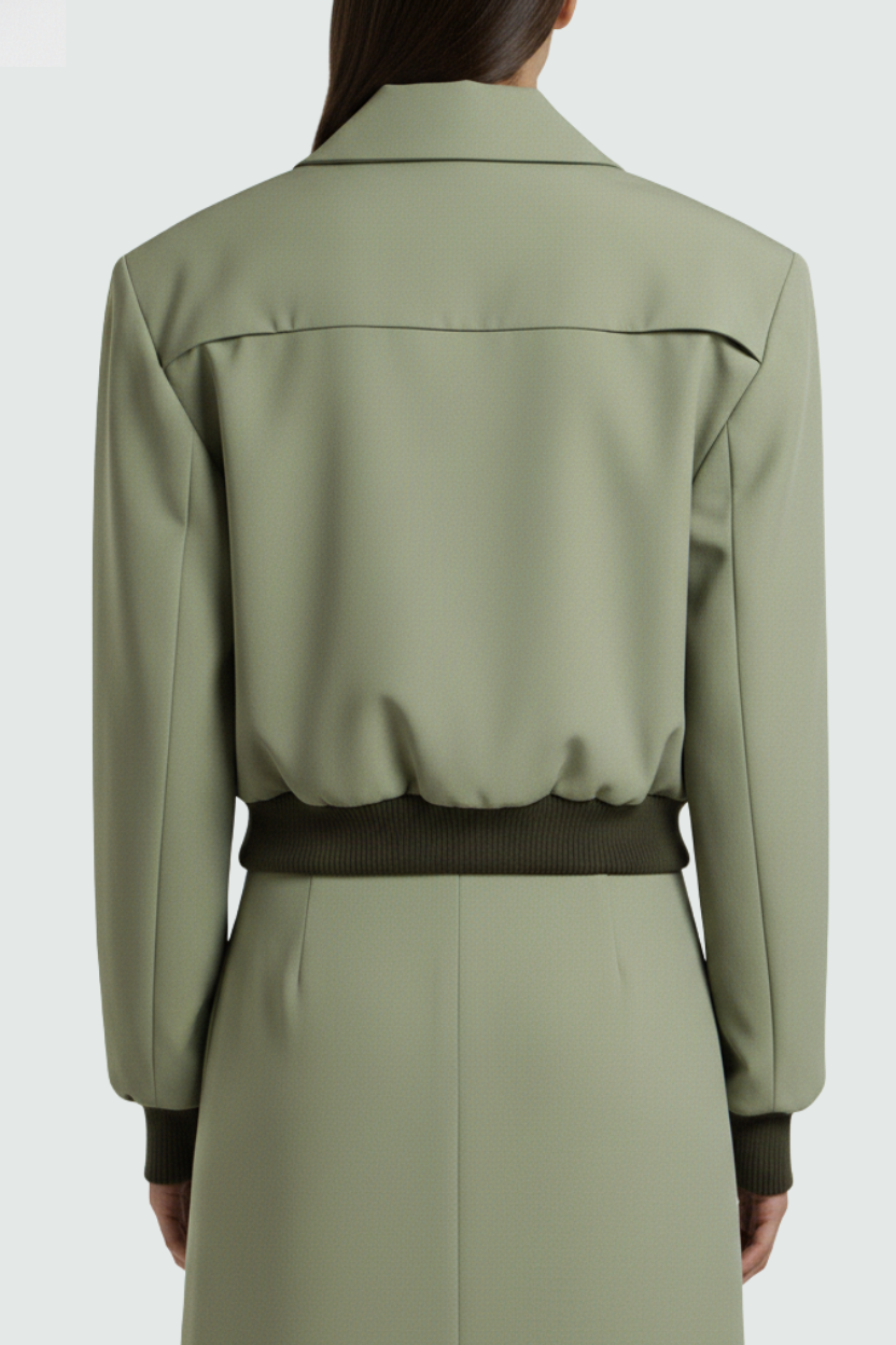 Sage green utility bomber jacket styled with tailored trousers