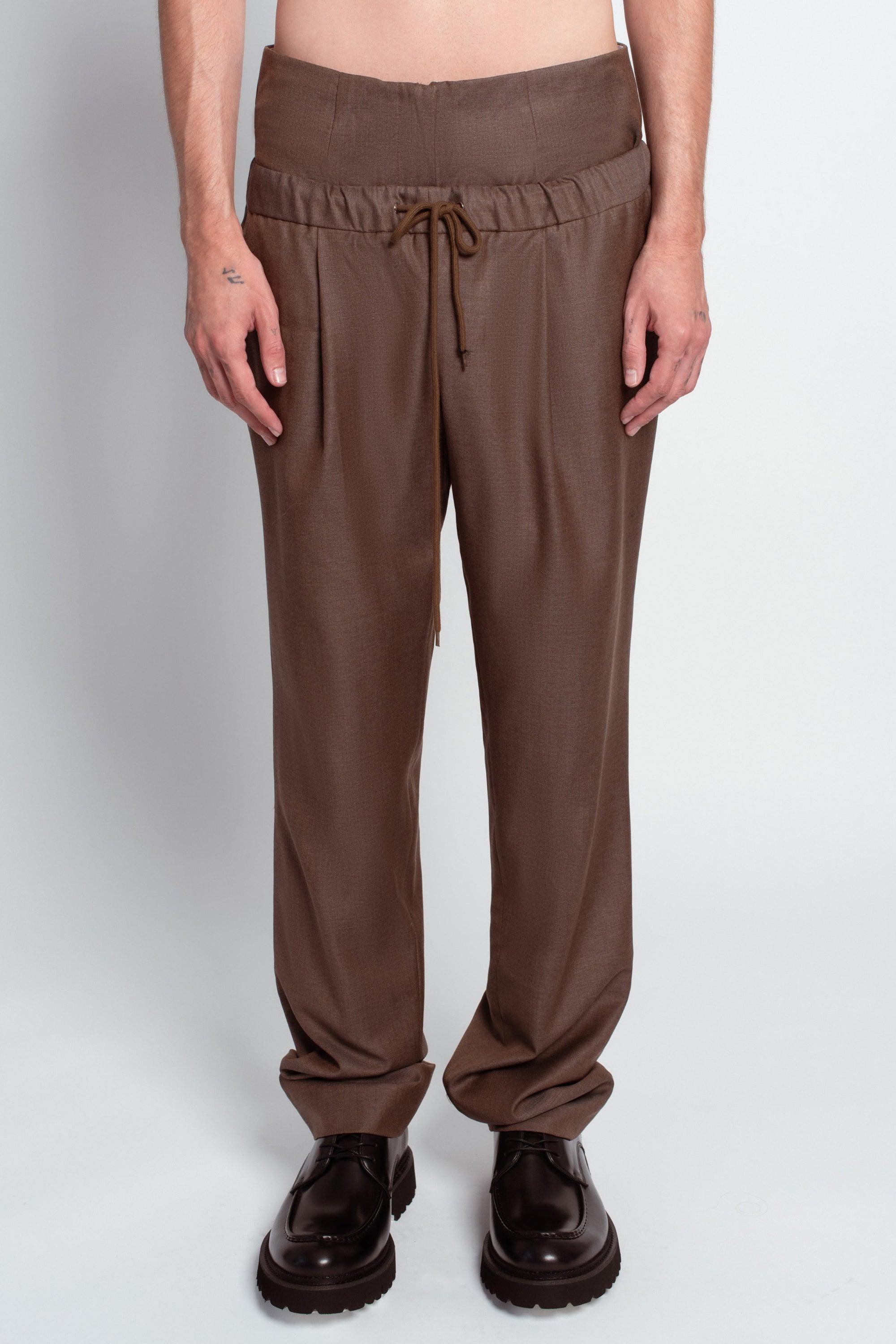 Brown wide-leg trousers dual-layer construction detail