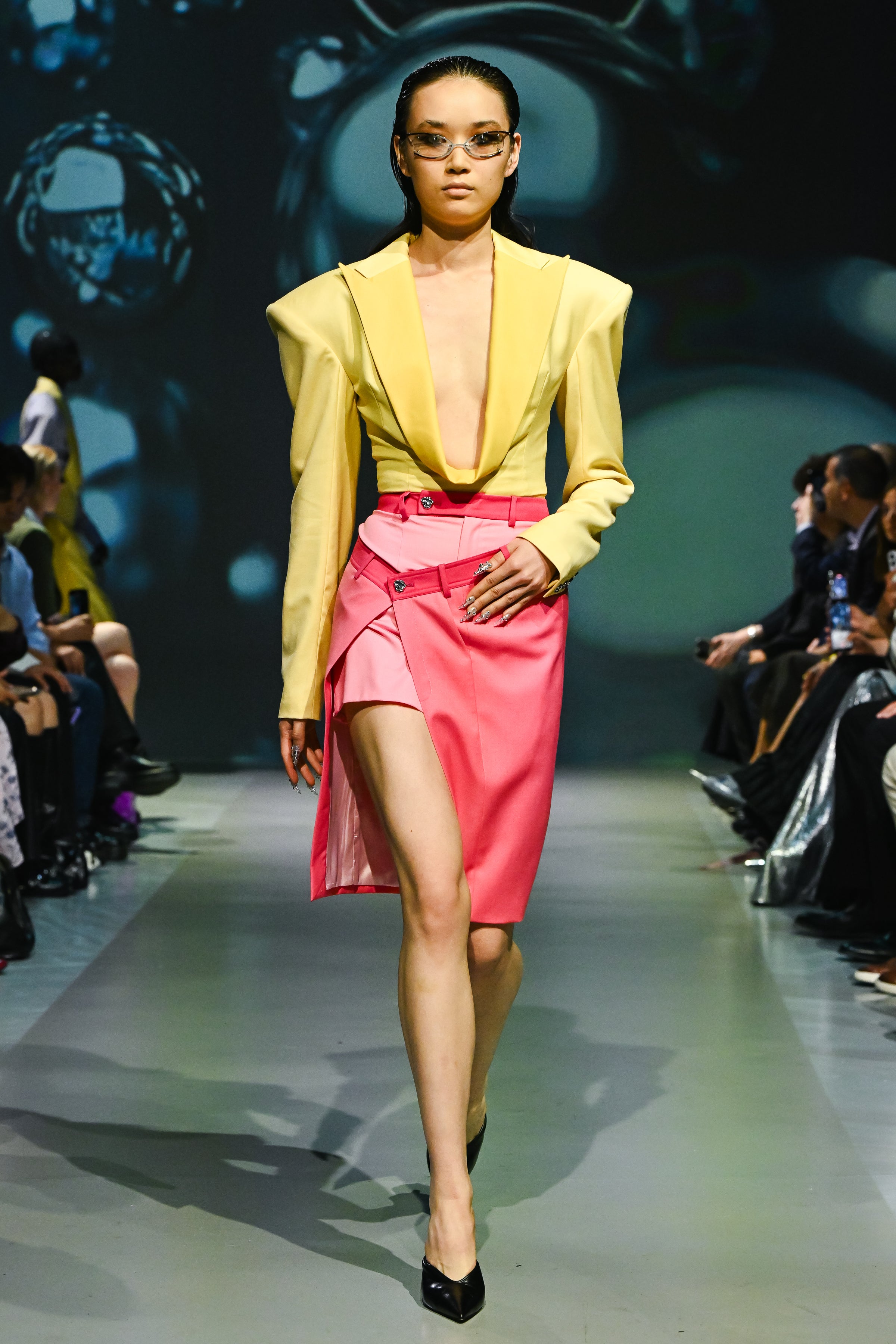 SHAO yellow draped peak lapel suited bodysuit styled on runway with plunging neckline