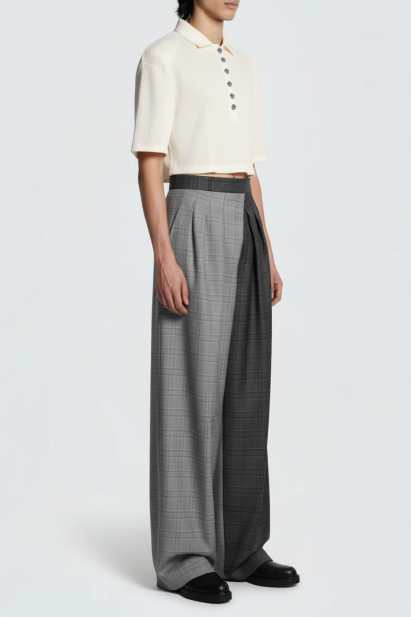 Model wearing Gray Check Wide-Leg Pleated Trousers featuring a dual-tone check pattern with deep front pleats, styled for a sculptural silhouette embodying SHAO New York’s luxury designer fashion.