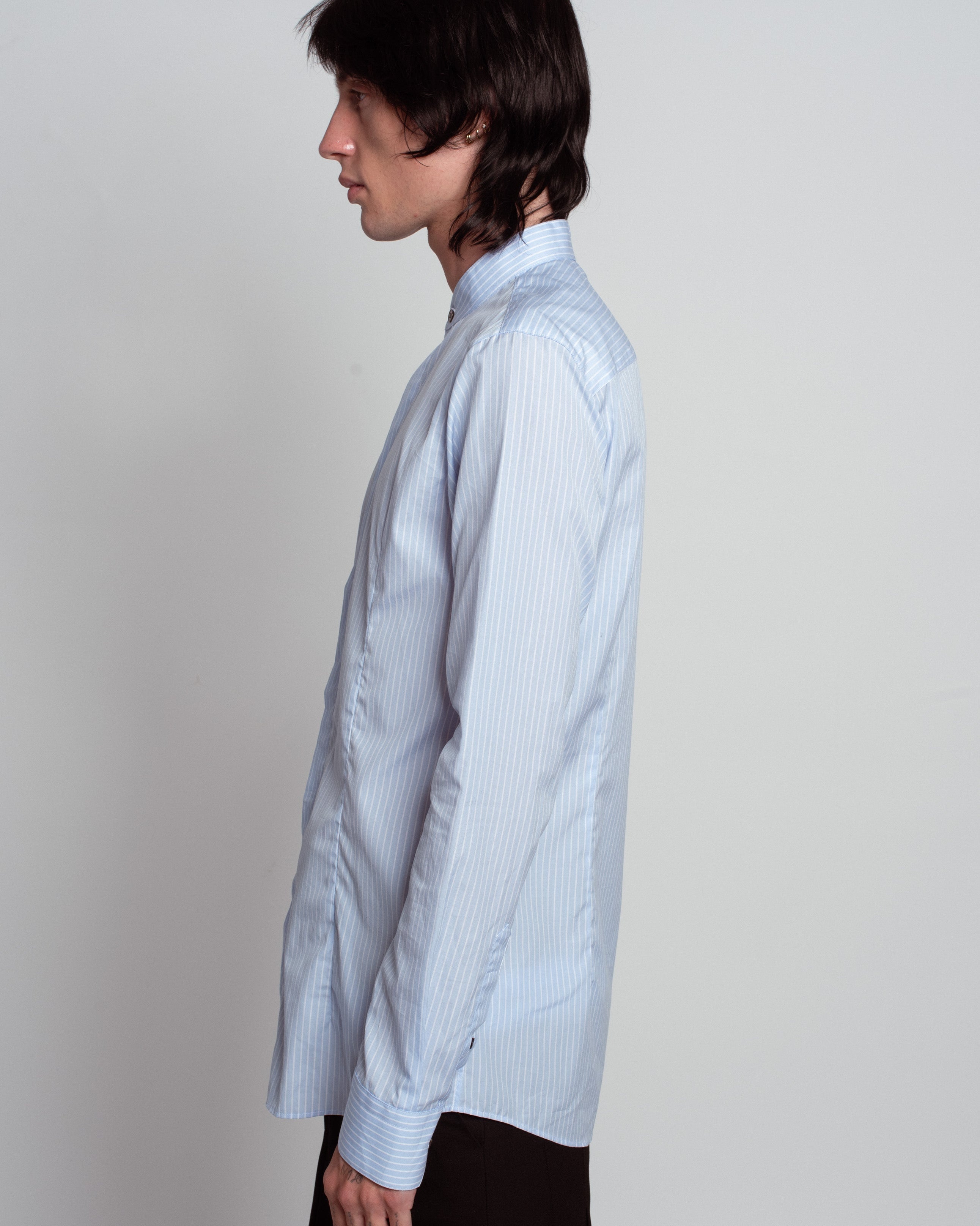 Blue Striped Band Collar Shirt in light blue with delicate vertical stripes, featuring a slim tailored fit, minimal band collar, and crisp cuffs, exemplifying SHAO New York bespoke tailoring and luxury designer fashion.