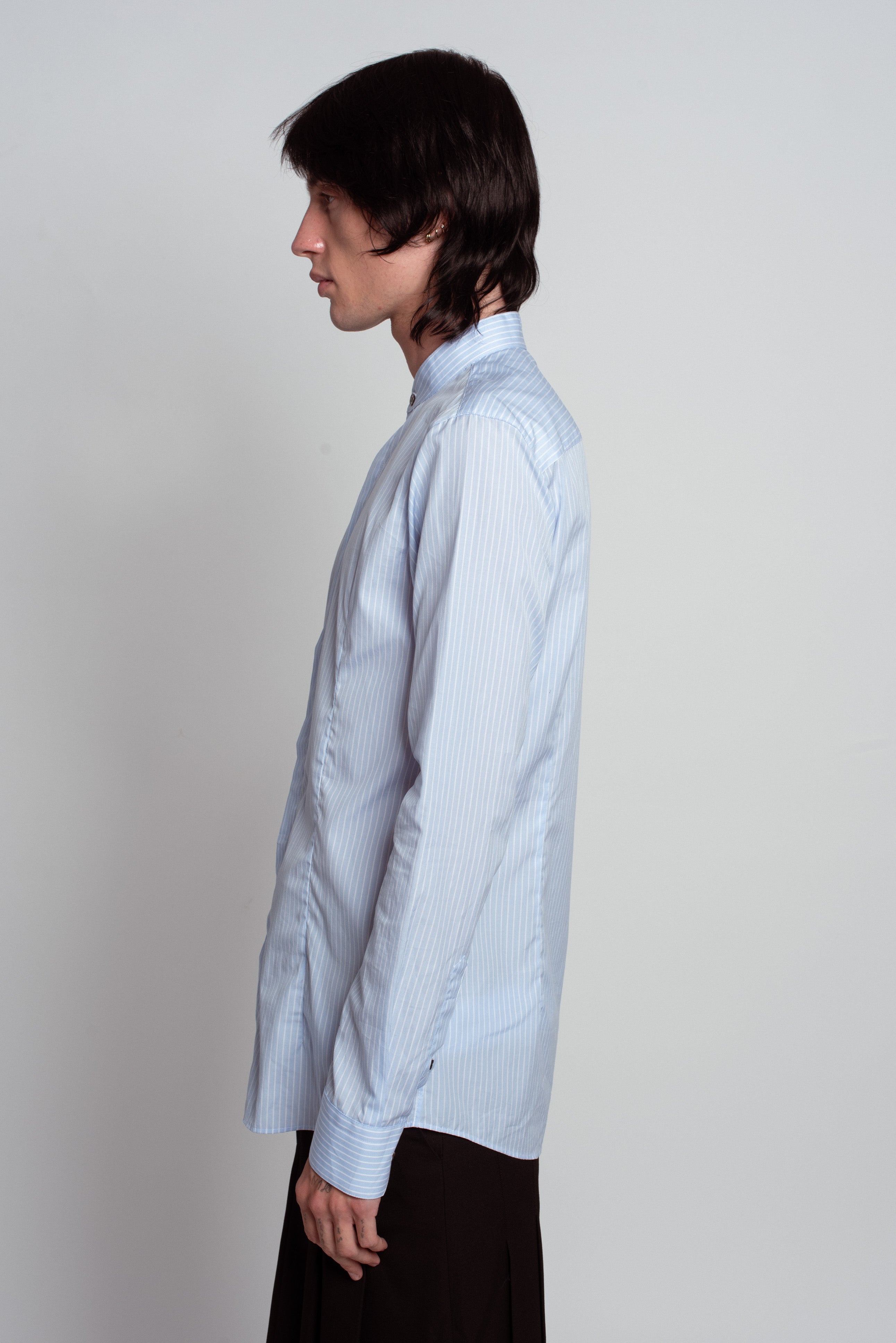 Blue Striped Band Collar Shirt in light blue with delicate vertical stripes, featuring a slim tailored fit, minimal band collar, and crisp cuffs, exemplifying SHAO New York bespoke tailoring and luxury designer fashion.
