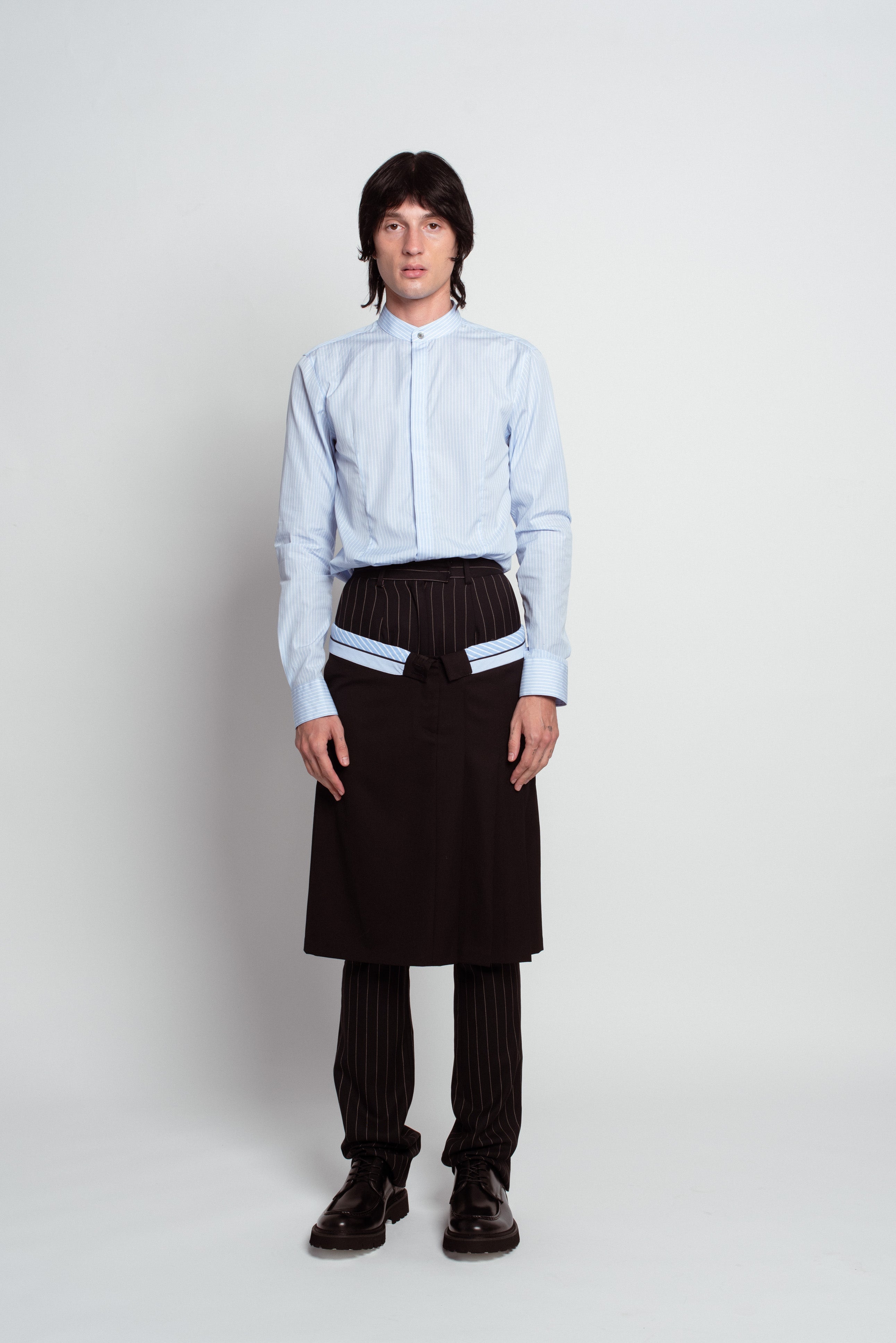 Blue Striped Band Collar Shirt in pale blue with subtle vertical stripes, featuring a stand-up collar, concealed button placket, and tailored fit, exemplifying SHAO New York bespoke tailoring.