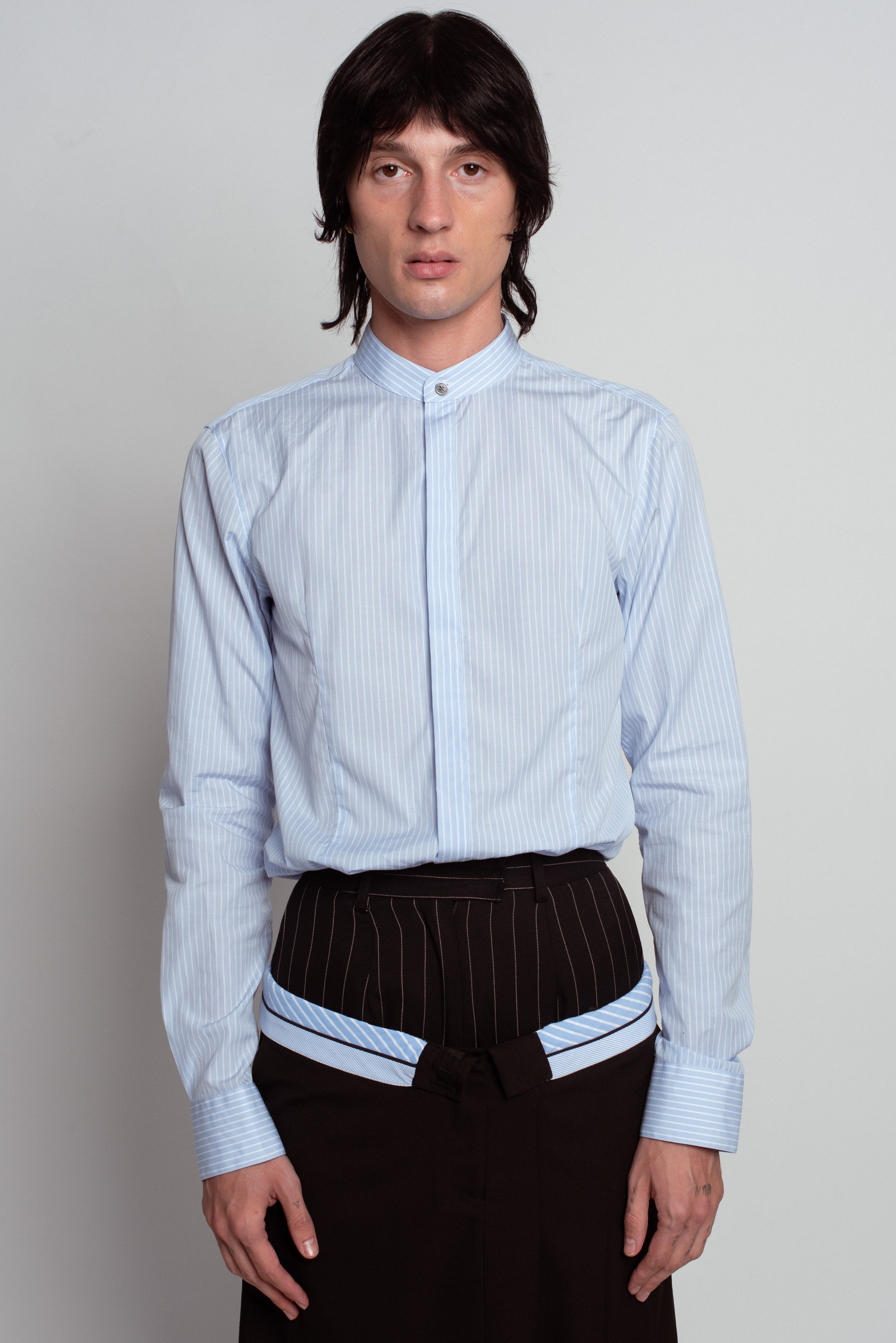 Front view of Blue Striped Band Collar Shirt in soft blue with subtle vertical stripes, featuring a concealed button placket, tailored fit, and crisp cuffs, showcasing SHAO New York bespoke tailoring and luxury designer fashion.