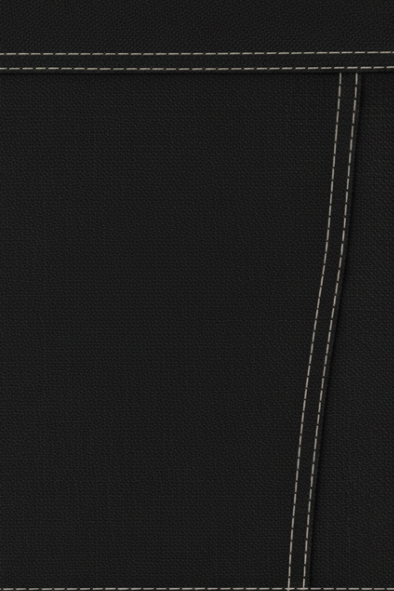Close-up swatch of black denim with contrast topstitching, rigid texture, and high-waist construction used for the shorts