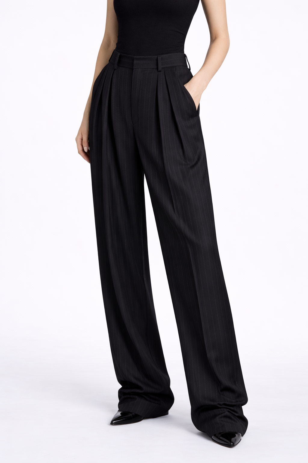Black Pinstripe Stacked Trousers featuring a high-waisted silhouette with relaxed wide legs, fine vertical pinstripes, and tailored pleats, embodying SHAO New York luxury fashion.