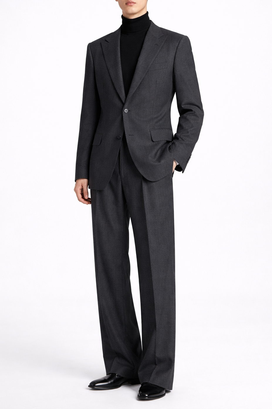 Model wearing a Charcoal Grey Relaxed Fit Jacket with a single-button closure, notch lapels, and a refined sculptural silhouette, paired with matching wide-leg trousers exemplifying SHAO New York bespoke tailoring.