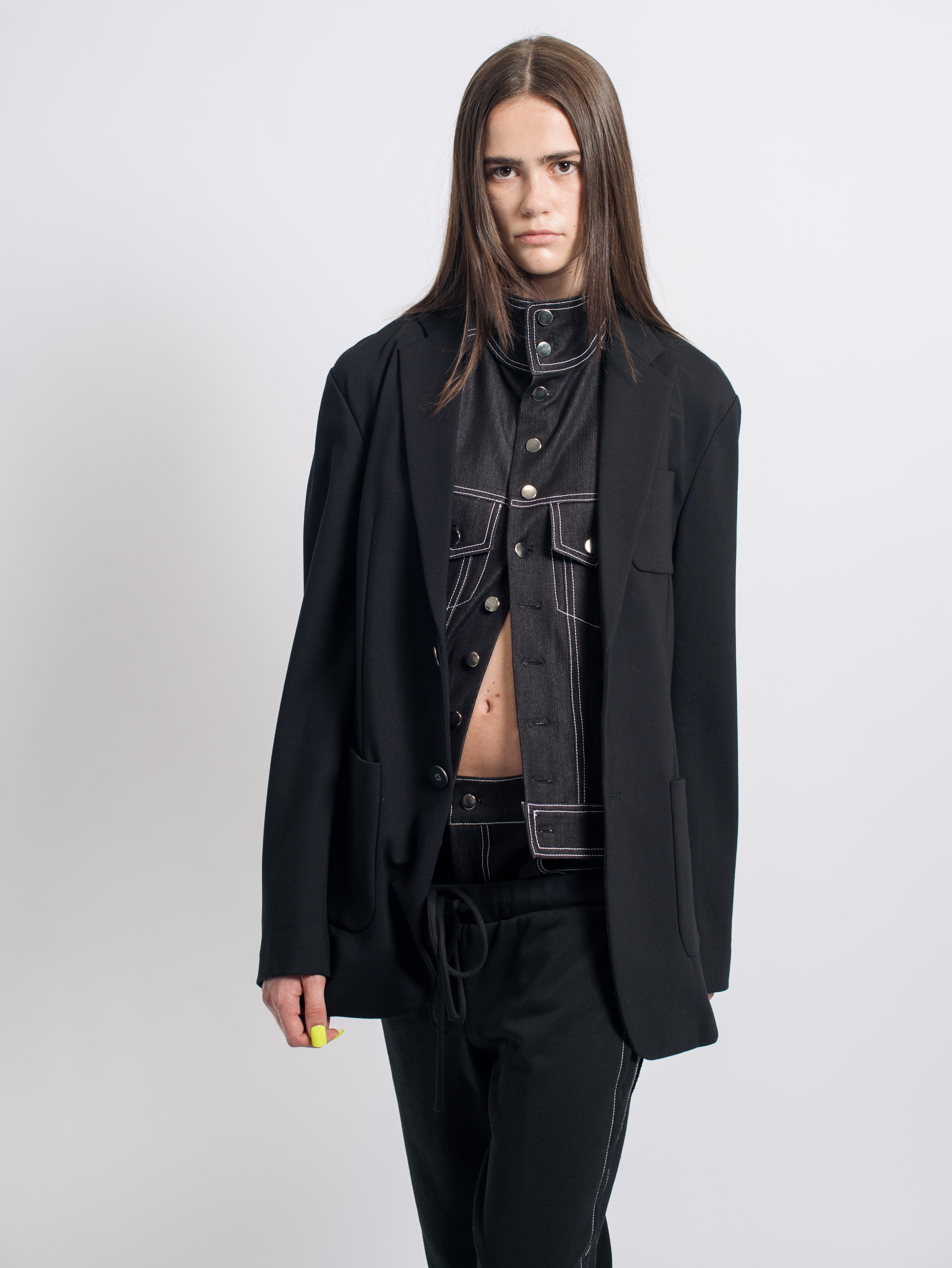 Black Blazer with Removable Denim Insert styled with a high-collar black denim vest featuring contrast stitching, paired with relaxed black trousers, highlighting SHAO New York’s bespoke tailoring and luxury designer fashion.