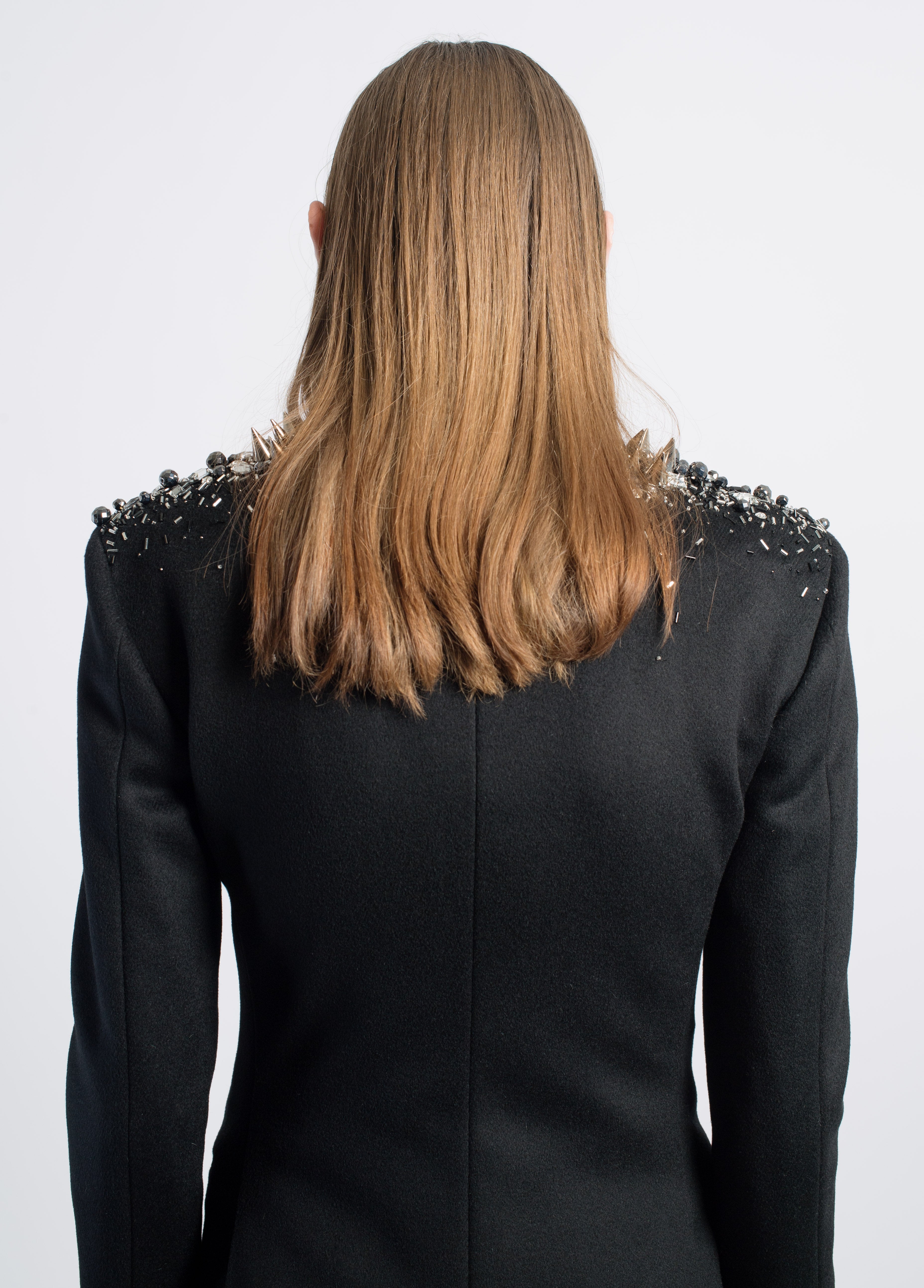 Black Crystal-Embellished Wool Blazer viewed from the back, highlighting sharp tailored shoulders adorned with intricate crystal and metal spike detailing, reflecting SHAO New York bespoke tailoring and a sculptural silhouette.