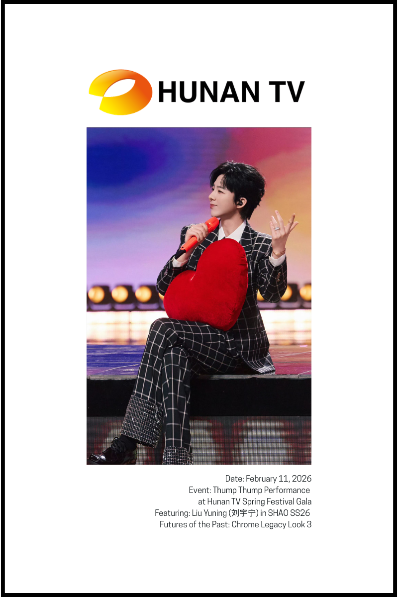 Singer in black and white suit