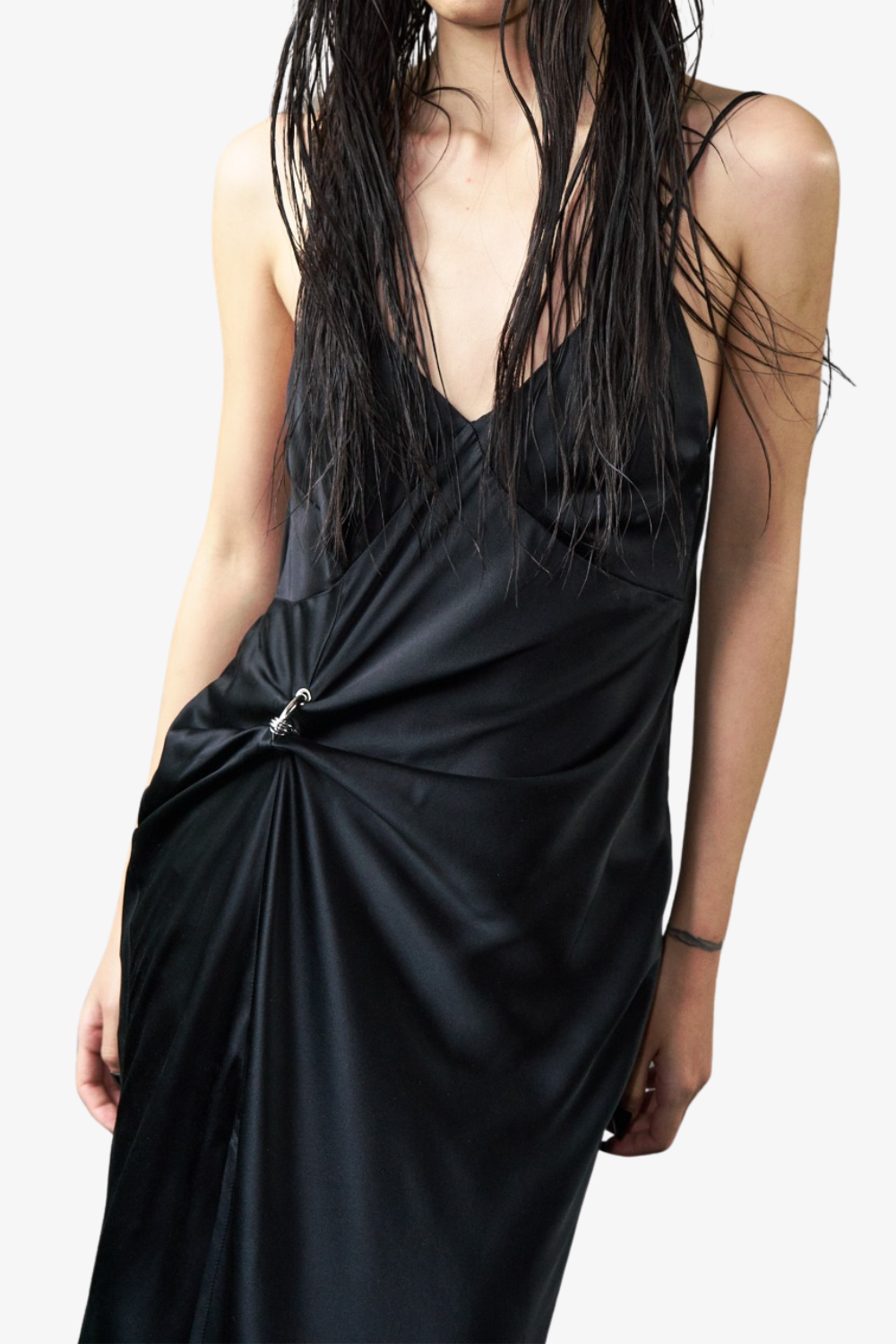 Model wears the Pierced Cowlback Slip Dress in lustrous black satin with a plunging neckline, adjustable strap detail creating a subtle gathering, showcasing SHAO New York bespoke tailoring and luxury designer fashion.