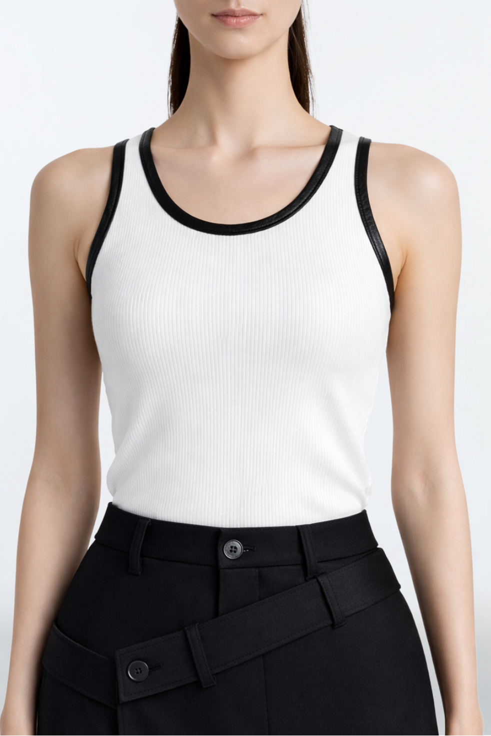 White Rib-Knit Tank Top with Leather Trim featuring a sleek ribbed texture and contrasting black leather edging, embodying SHAO New York’s luxury designer fashion with a sculptural, tailored look.