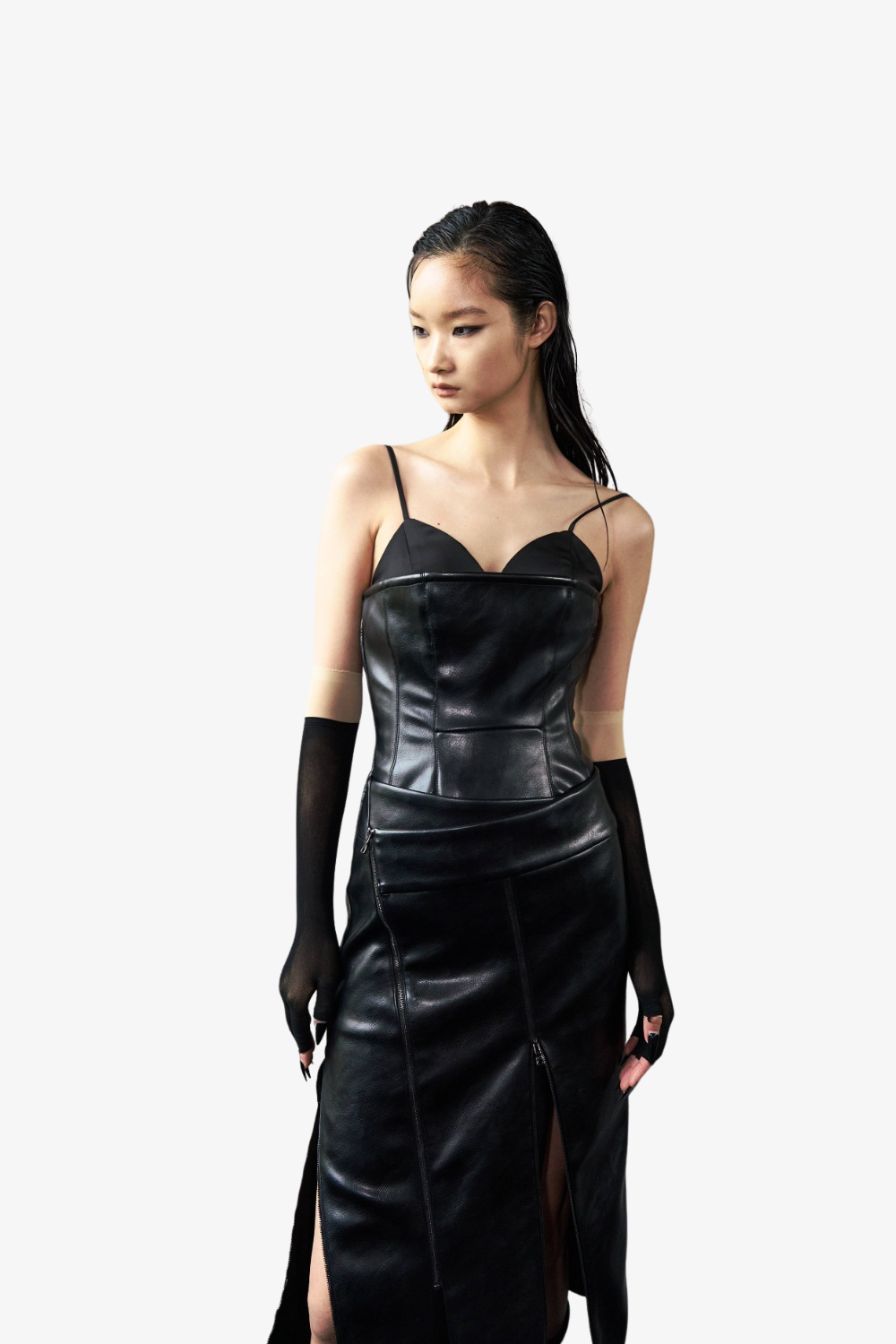 Model wearing the Vegan Leather Biker Dress in black with thin straps, asymmetrical zipper details, a front slit, paired with sheer black gloves, showcasing SHAO New York bespoke tailoring and a sculptural silhouette.