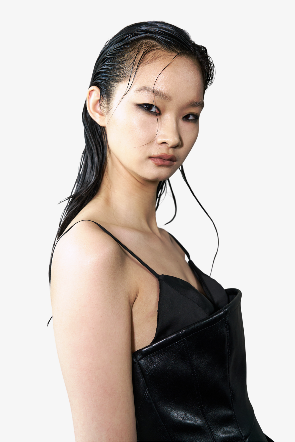 Model wearing the Vegan Leather Biker Dress with thin straps and a minimalist design, featuring subtle sculptural details and a smooth, glossy texture that highlights SHAO New York bespoke tailoring.