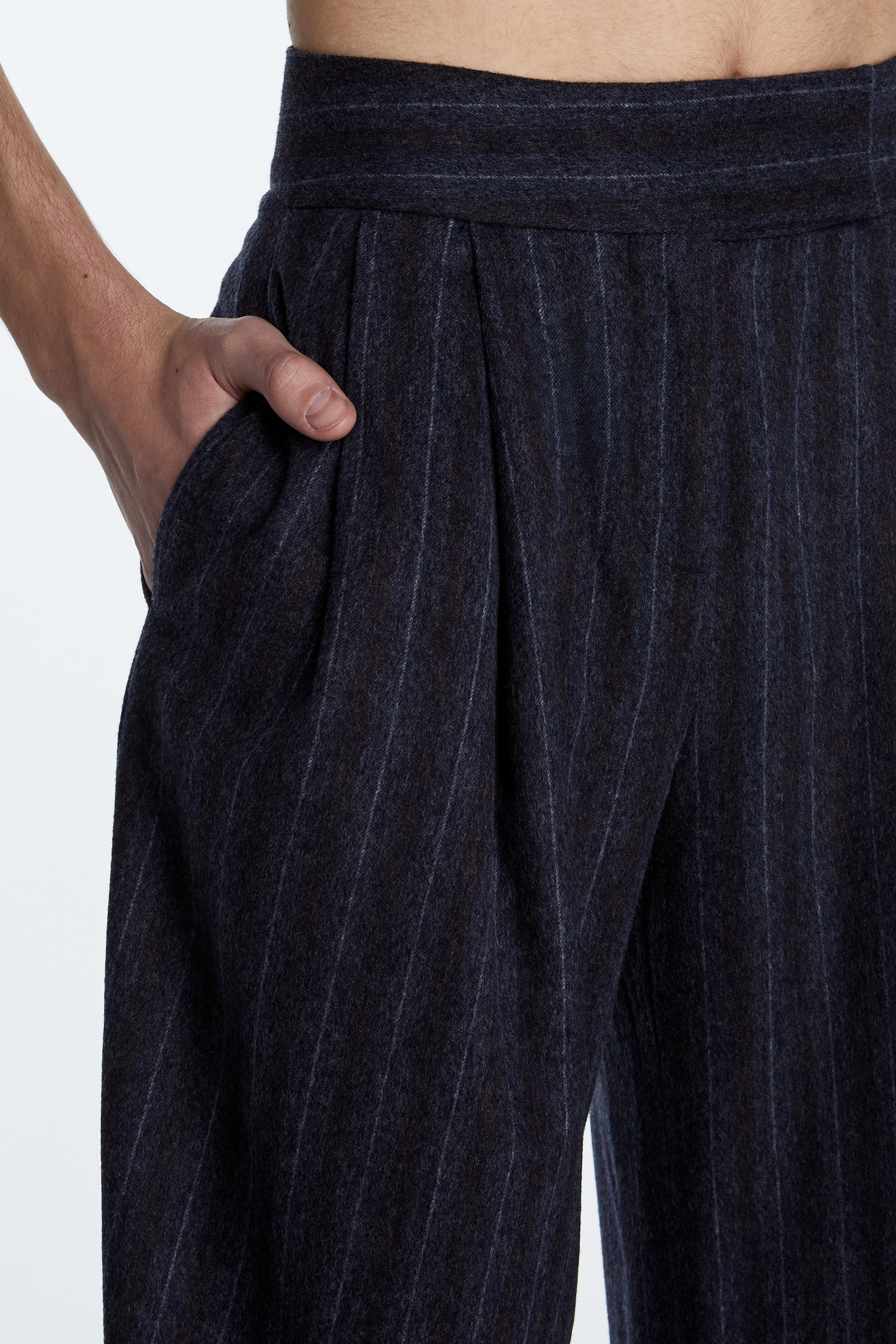 Charcoal Grey Pinstripe Barrel-Leg Trousers – Savile Row Inspired Tailoring with high waist and sculptural silhouette.