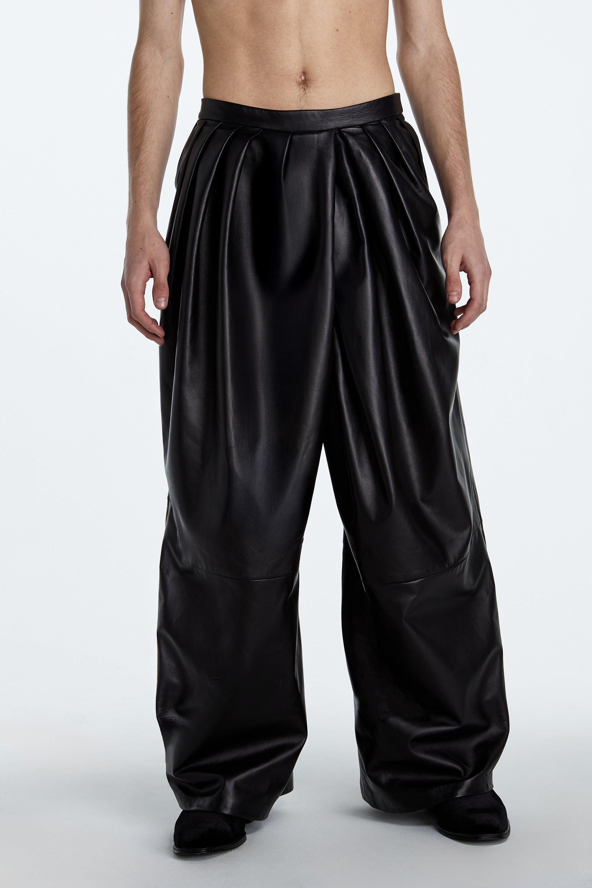 Jet Black Leather Asymmetrical Pleated Trousers – Flowing Architectural Cut