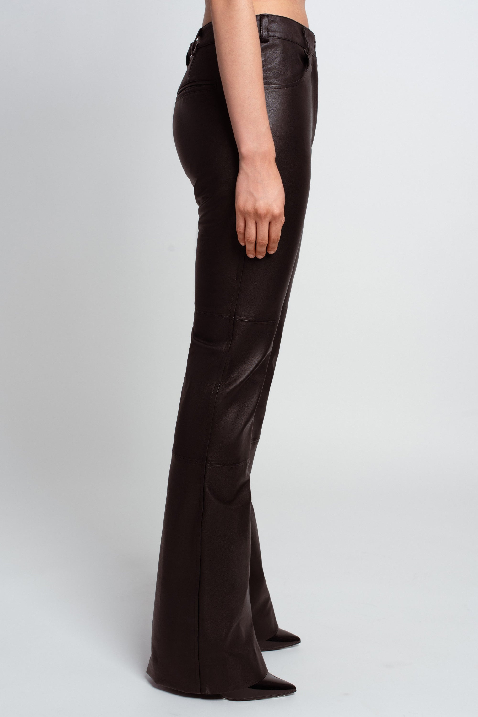 Black leather flared trousers construction detail