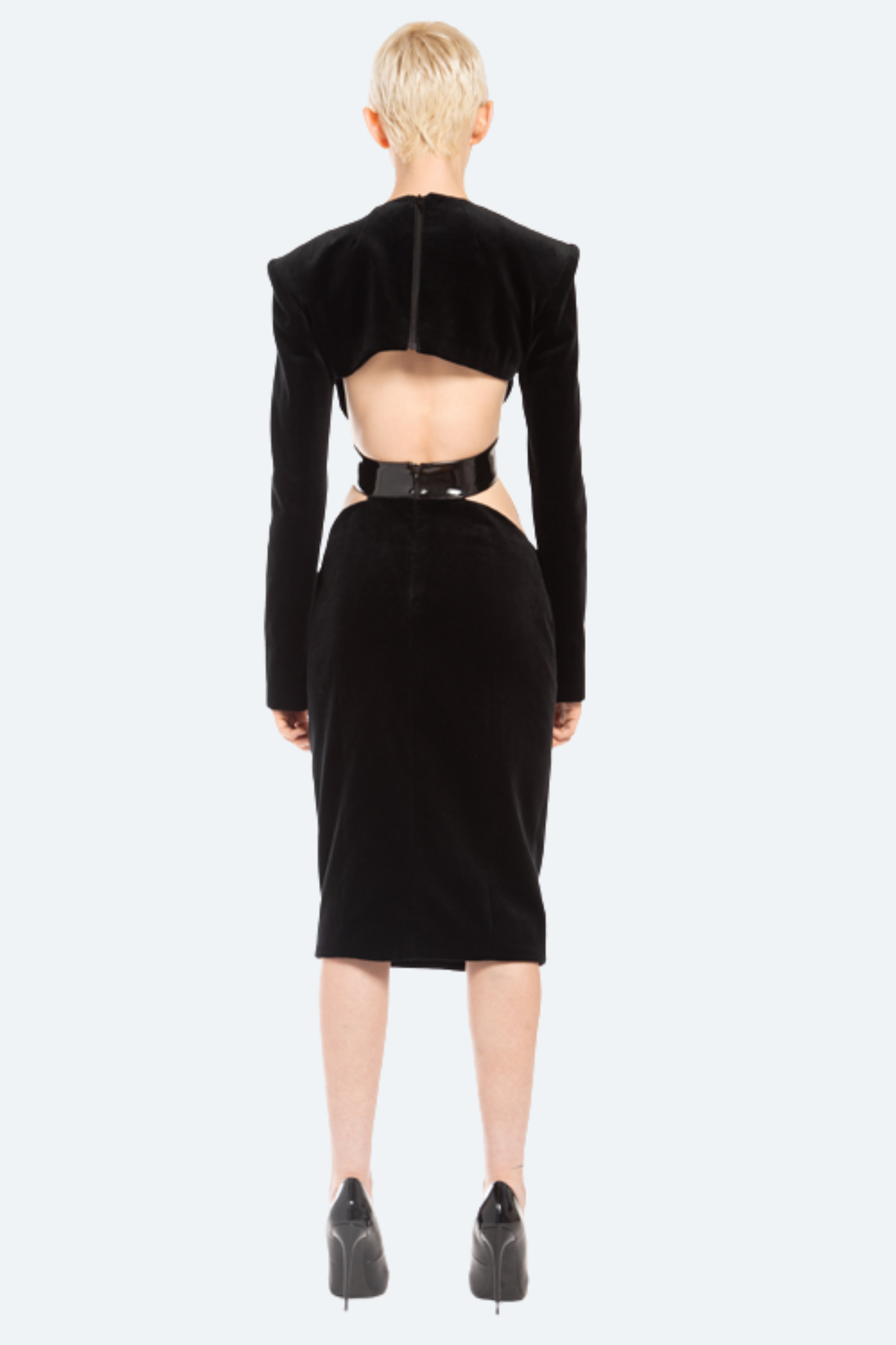 Back view black velvet cutout dress with open waist and leather belt
Detail view patent leather belt and velvet texture