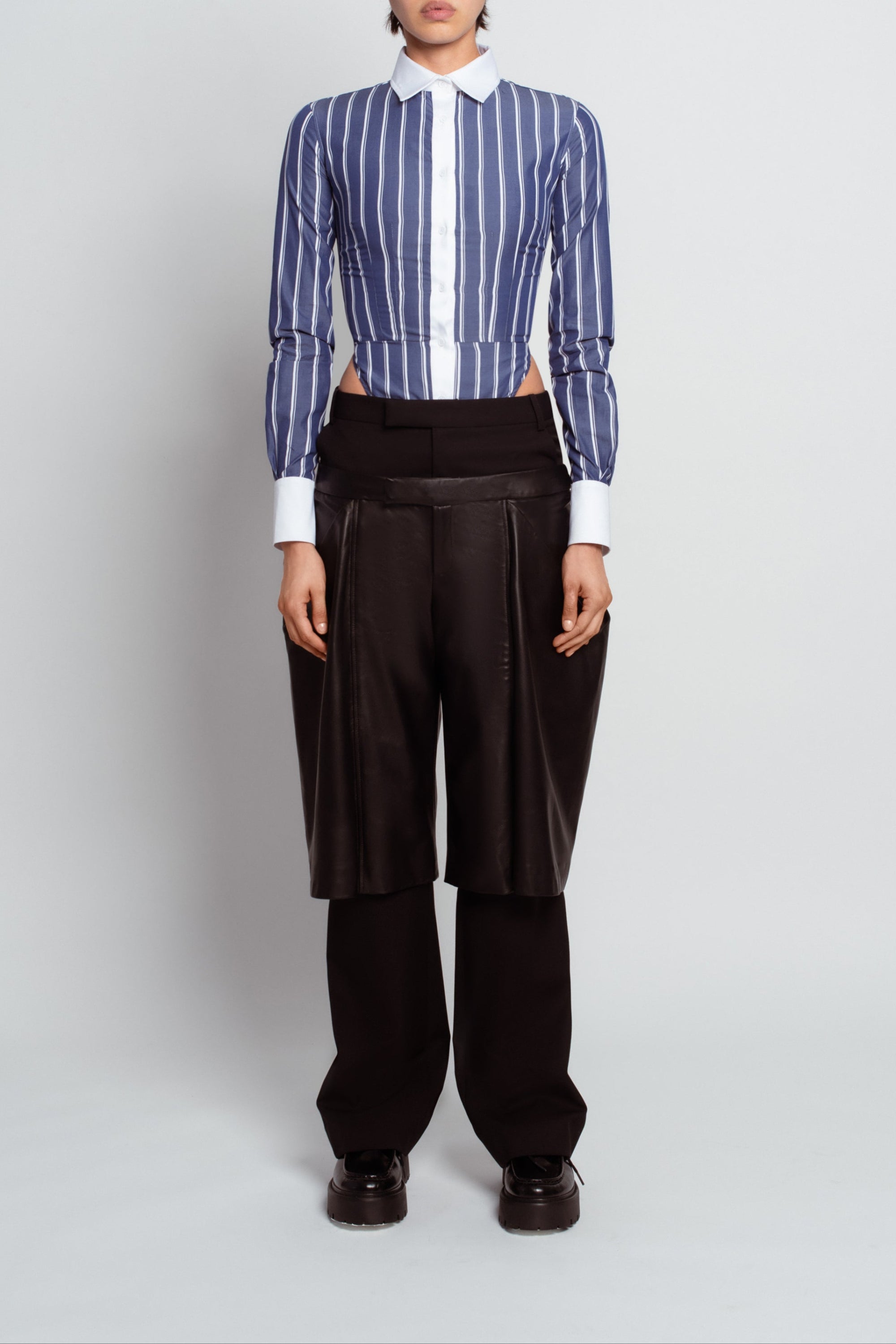 Black straightleg wool trousers with leather shorts overlay front view