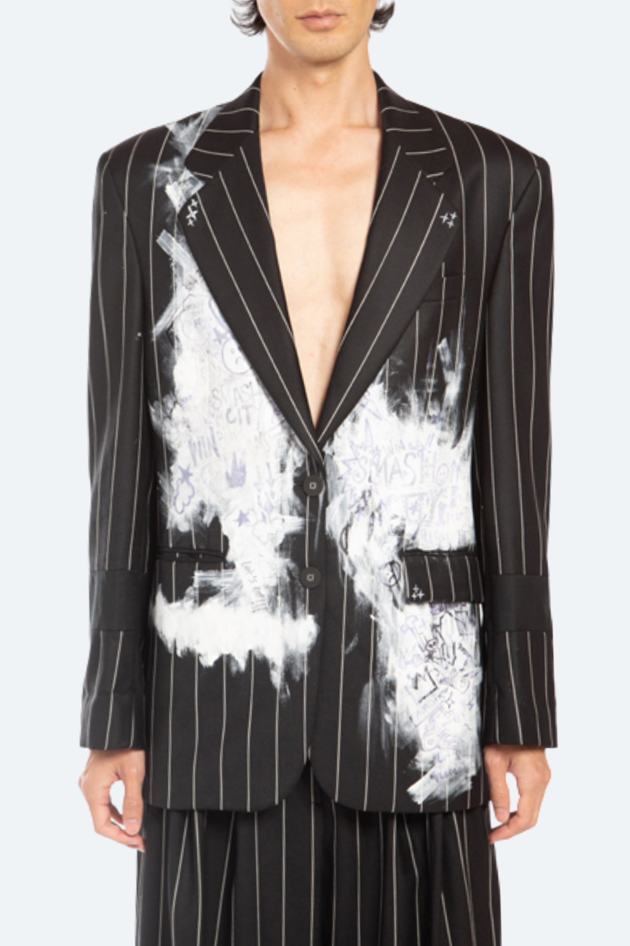 Front view of black pinstripe blazer with white hand-painted artwork.